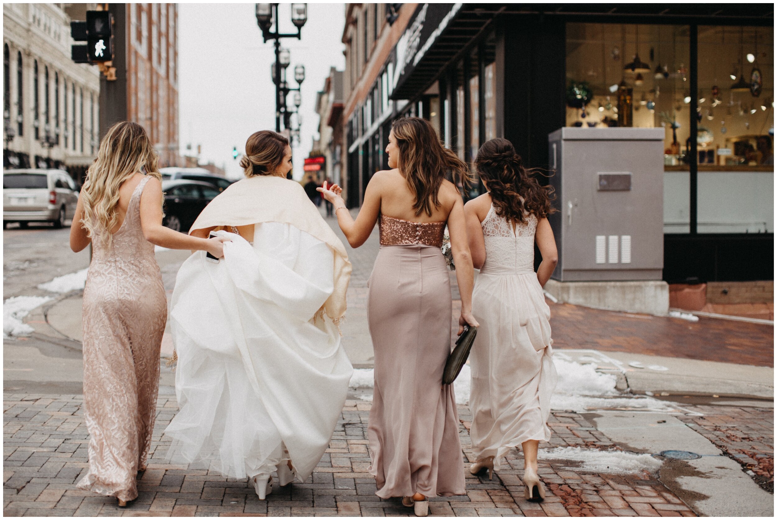 Bride walking with bridesmaids in downtown Duluth, Minnesota