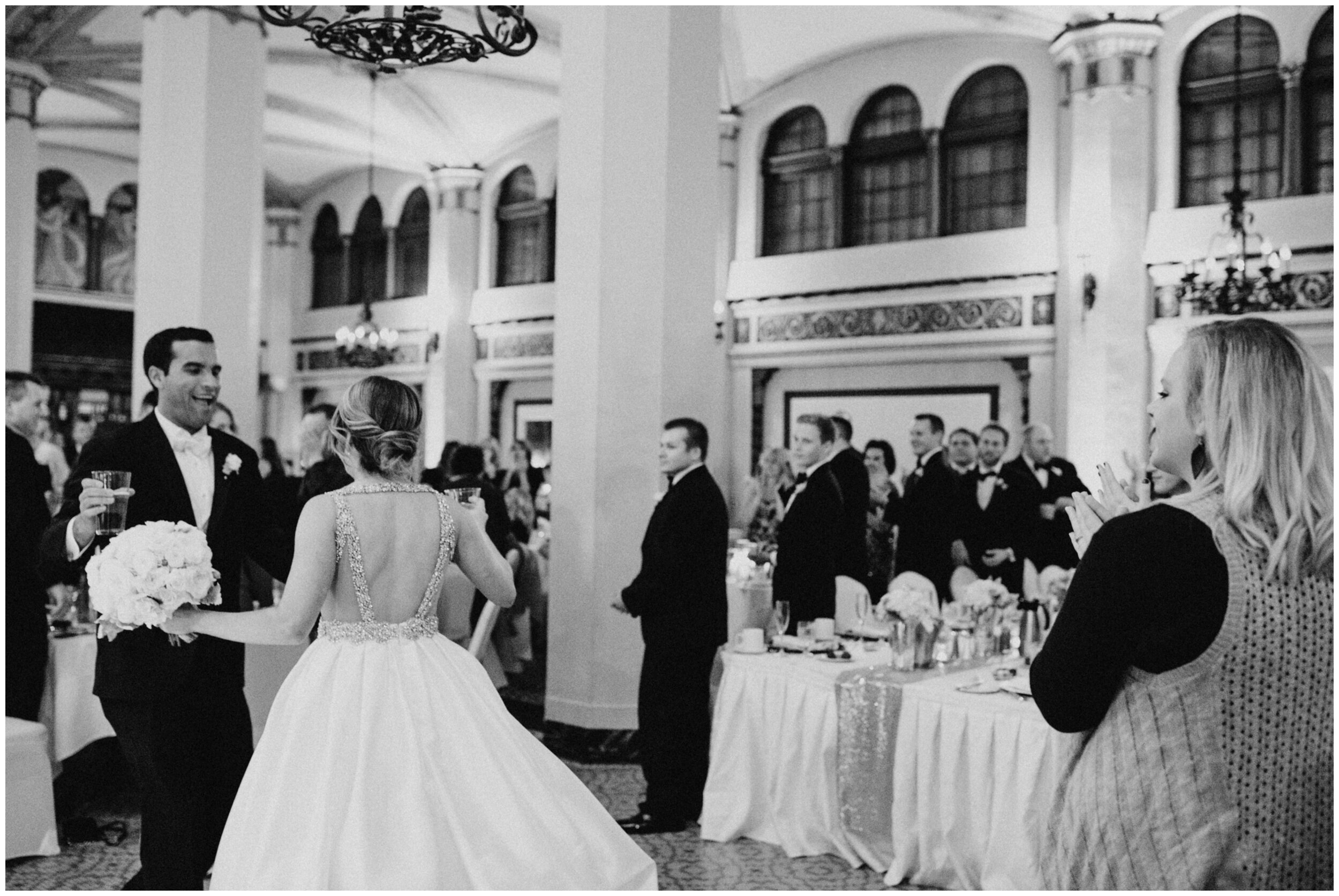 Bride and groom entering wedding reception in the Moorish Room at the Greysolon Plaza