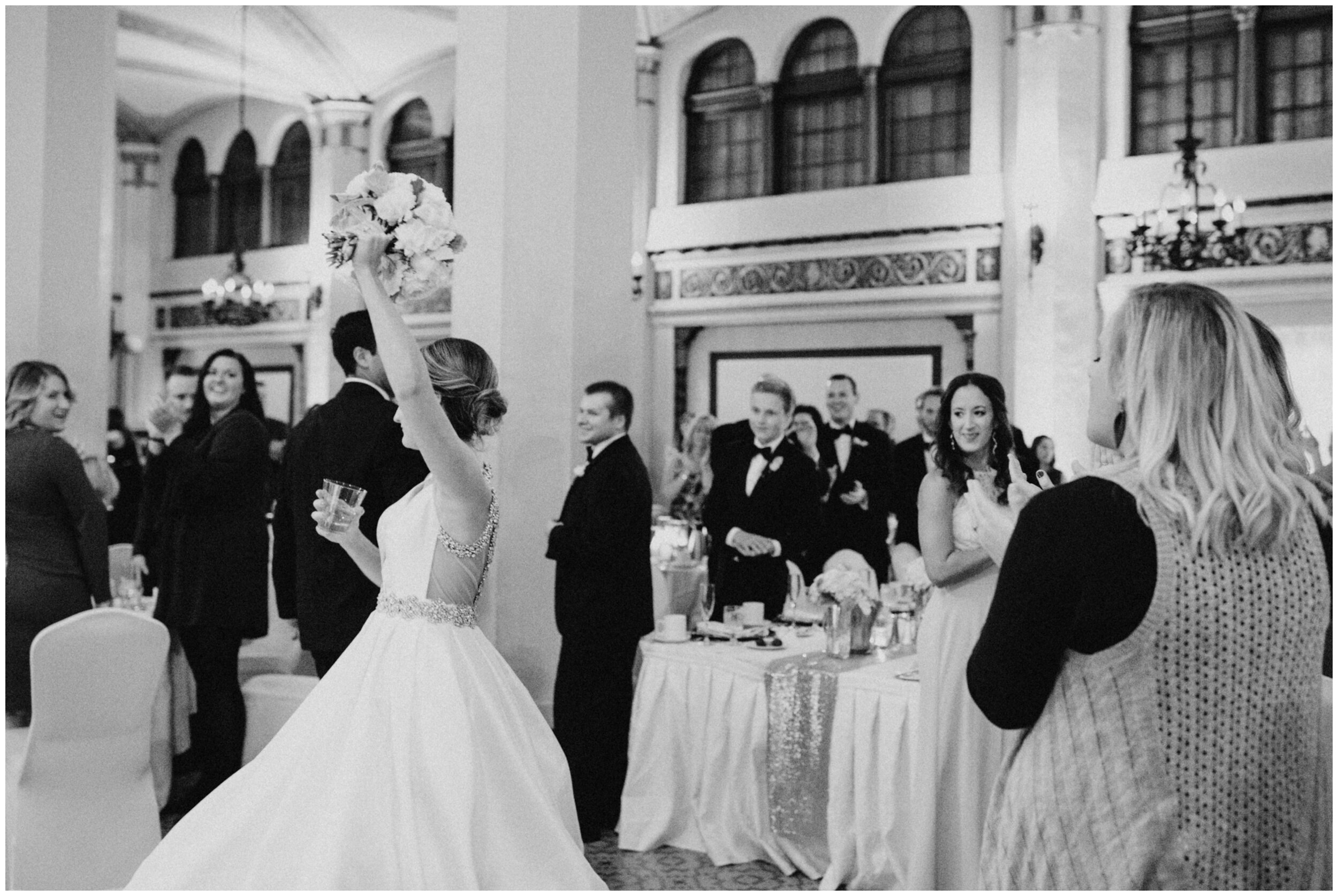 Bride and groom entering wedding reception in the Moorish Room at the Greysolon Plaza in Duluth, Minnesota