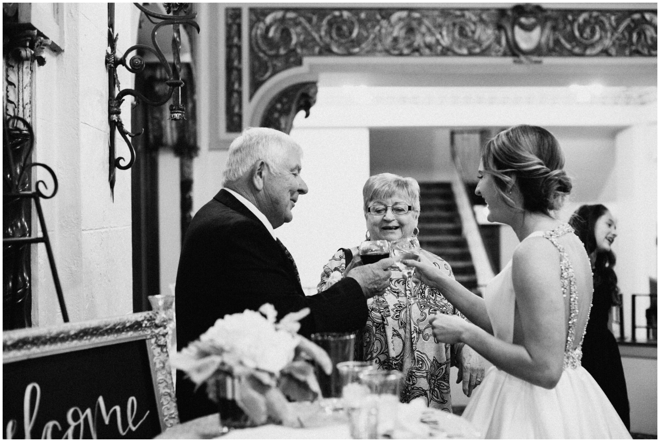 Bride toasting champagne with her grandparents at the Greysolon in Duluth