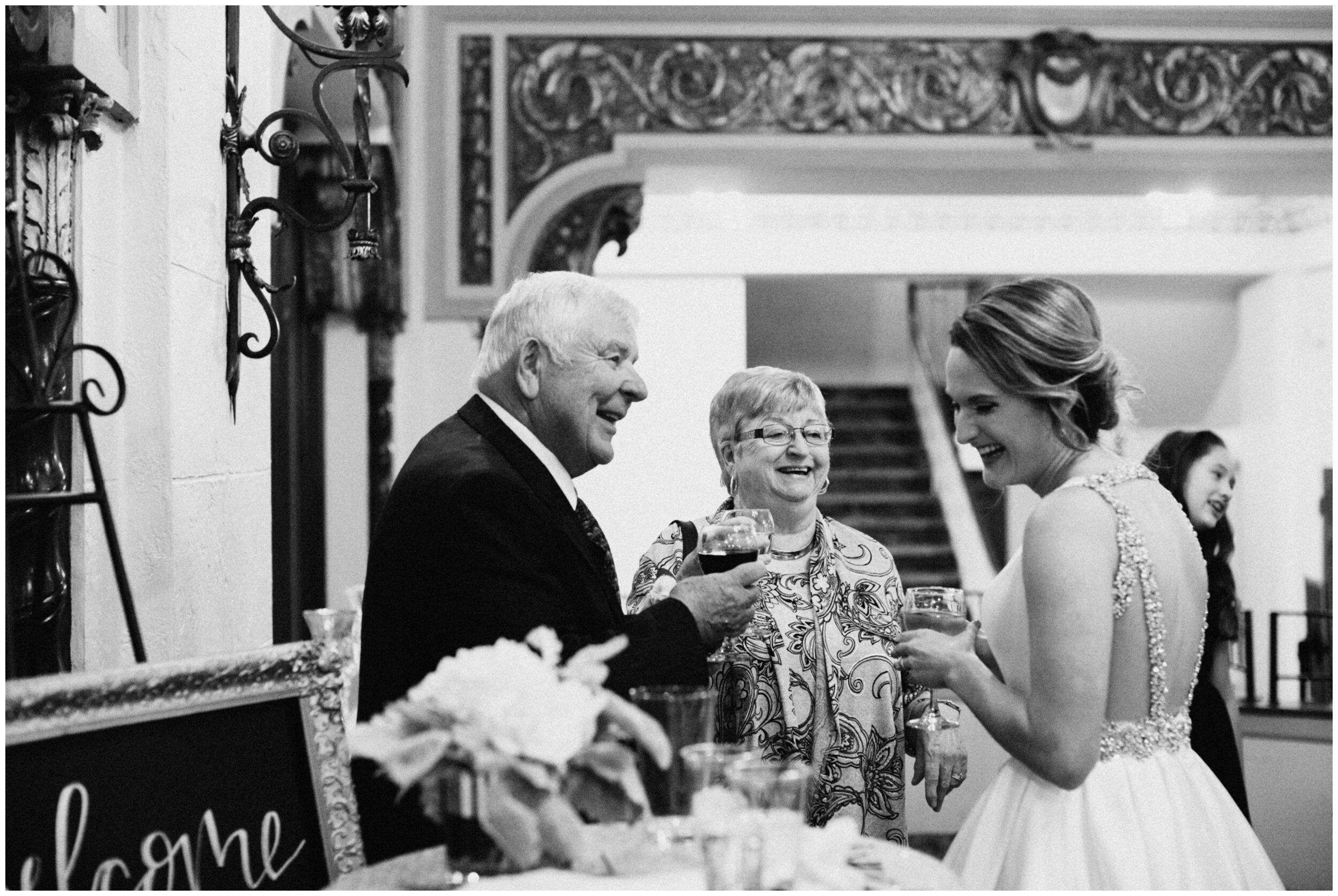 Bride toasting champagne with her grandparents at the Greysolon in Duluth, Minnesota