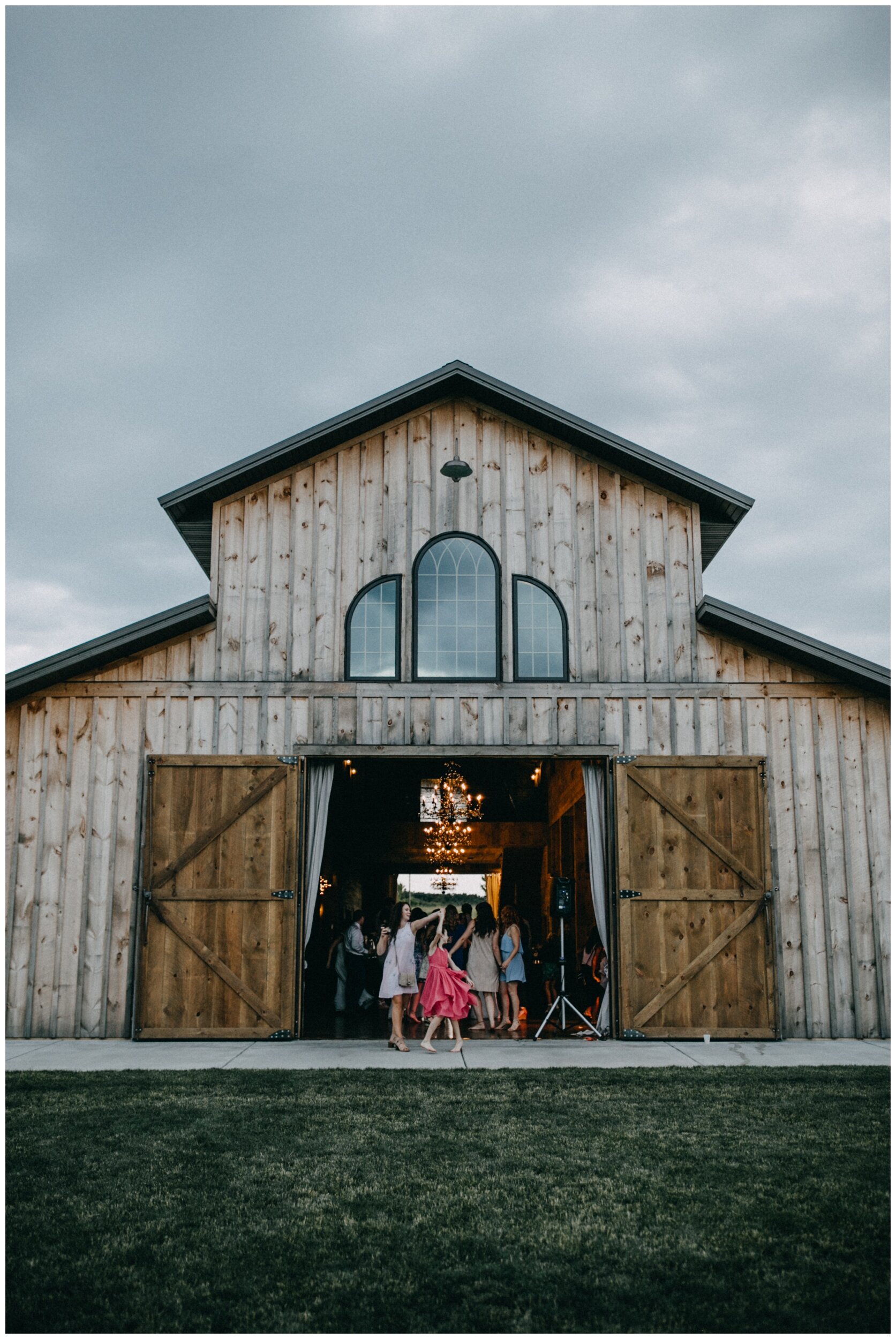 Wedding guests dancing in barn at Creekside Farm
