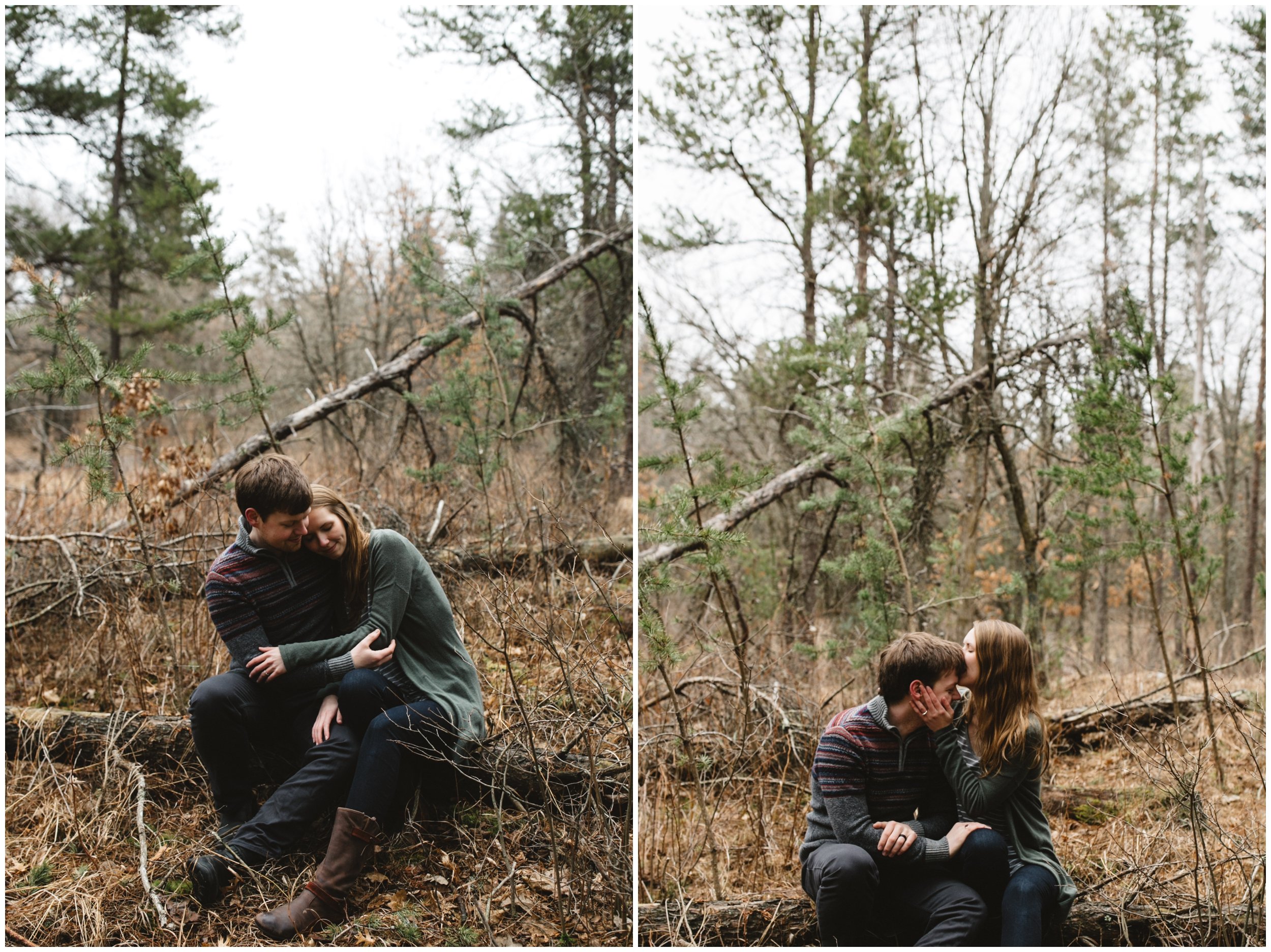 Couple sitting on log in the woods, hugging during romantic Minnesota engagement session