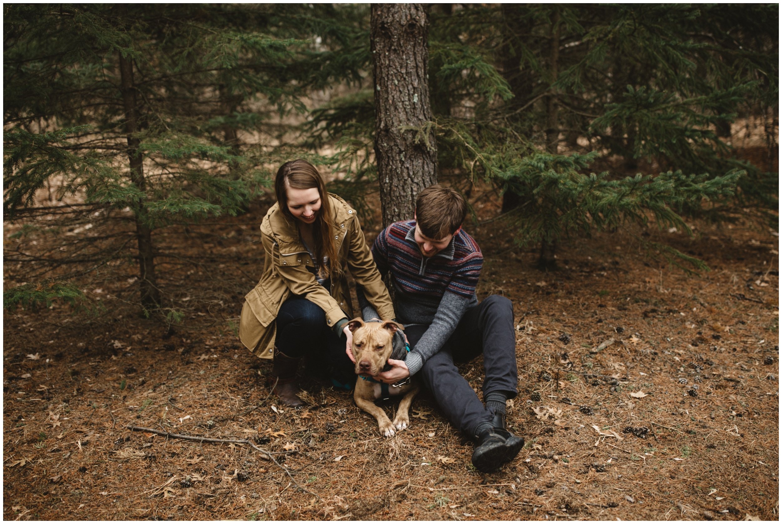 Minnesota late fall engagement session in the woods with couple's dog