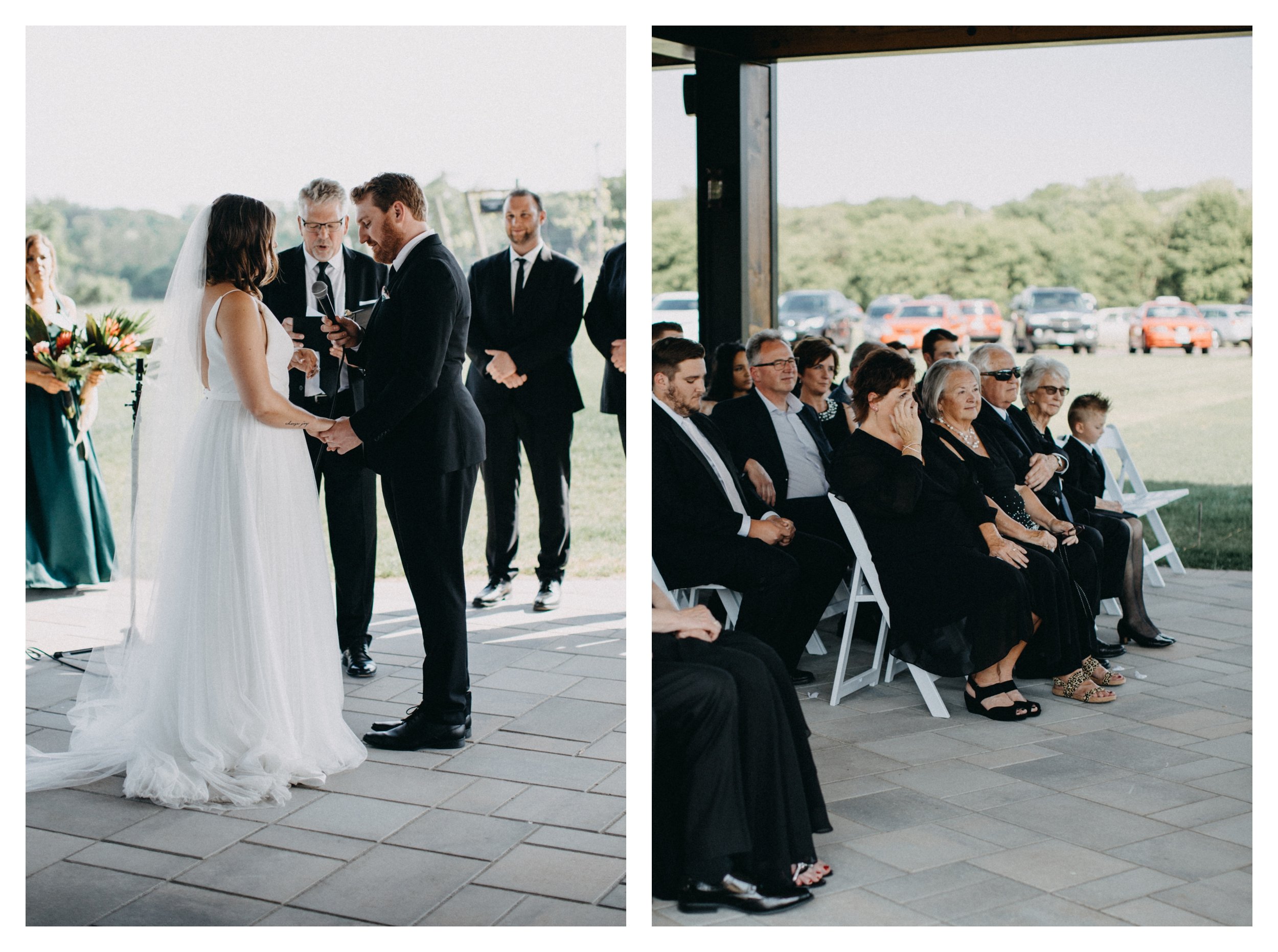 Mother of the bride crying during wedding ceremony as the bride and groom exchange vows overlooking a Minnesota vineyard wedding venue