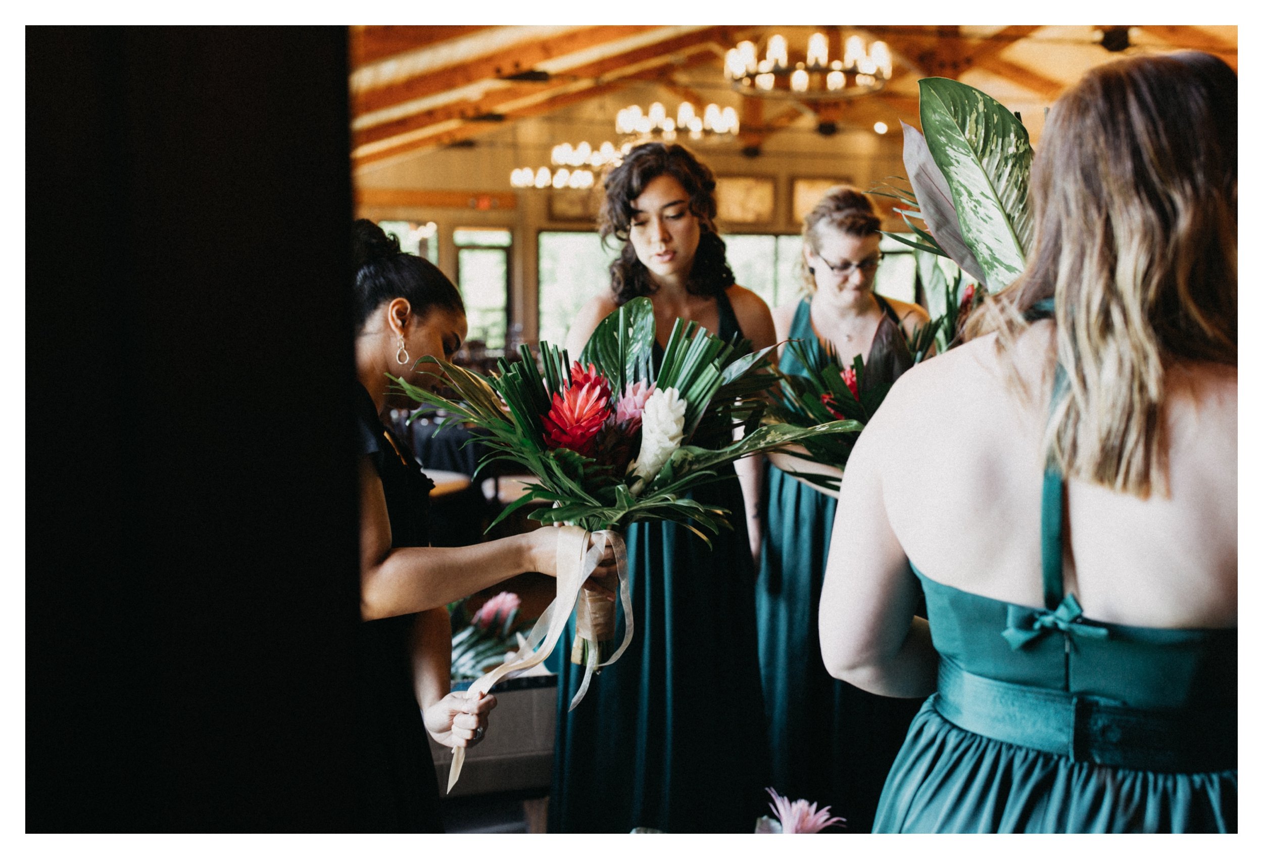 Bridesmaids gathering tropical flower bouquets 