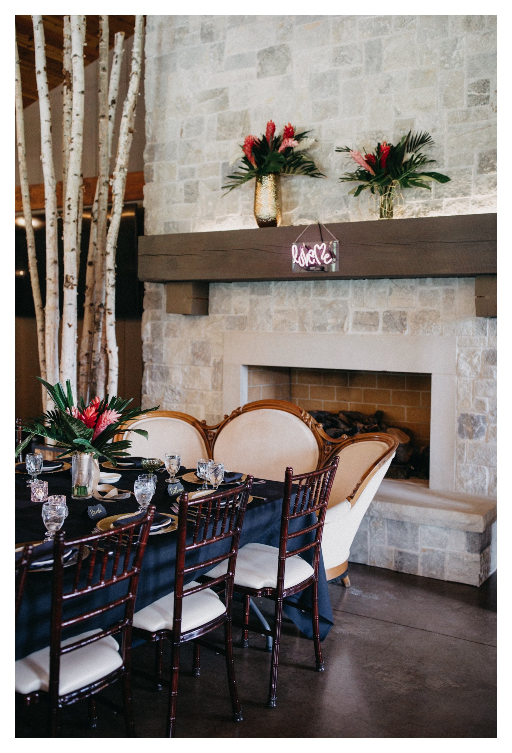 Luxury wedding table setting in front of fireplace at 7 vines vineyard wedding reception