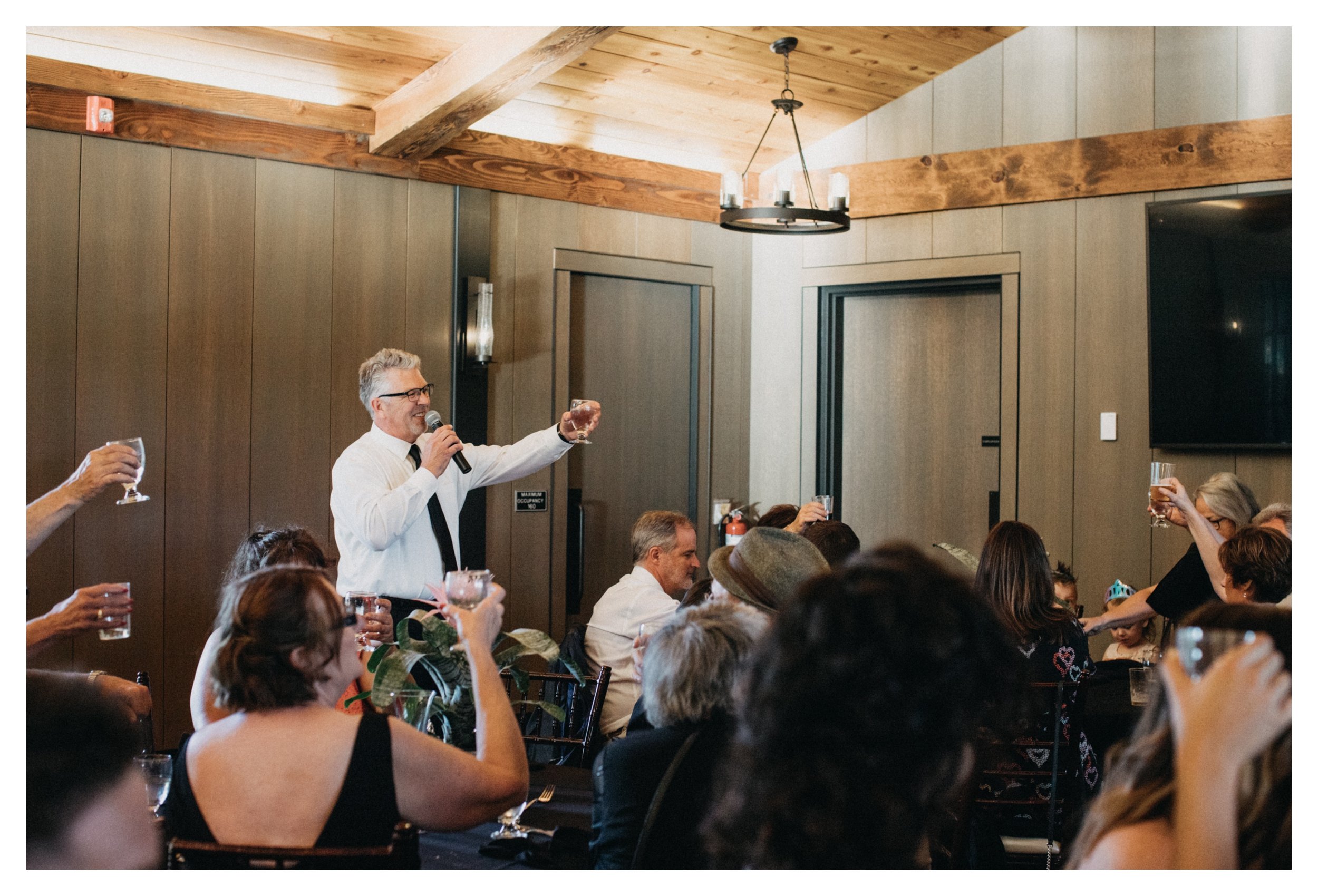 Father of the bride toasting bride and groom