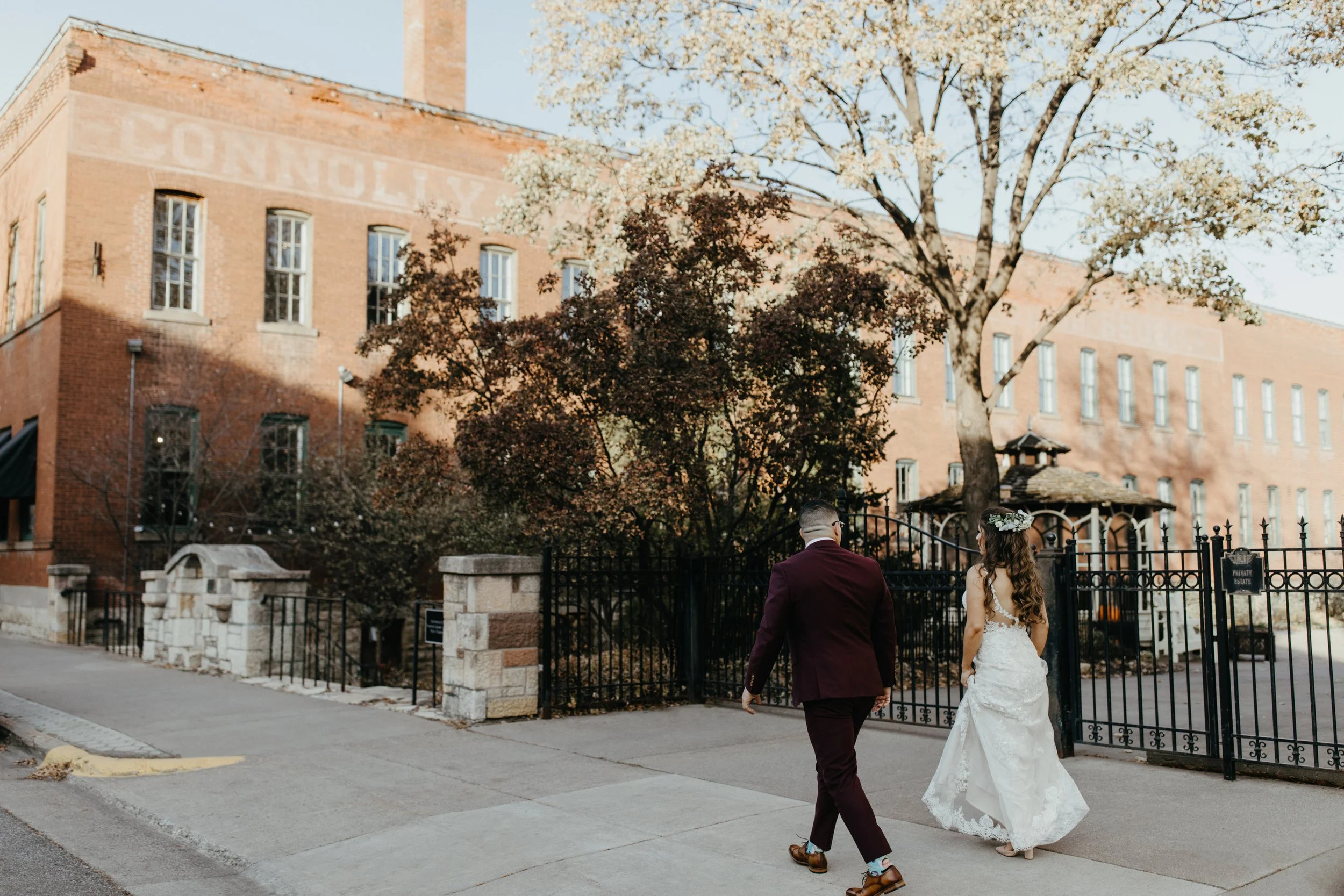 Bride and Groom walking in front of JX Venue in Stillwater, Minnesota