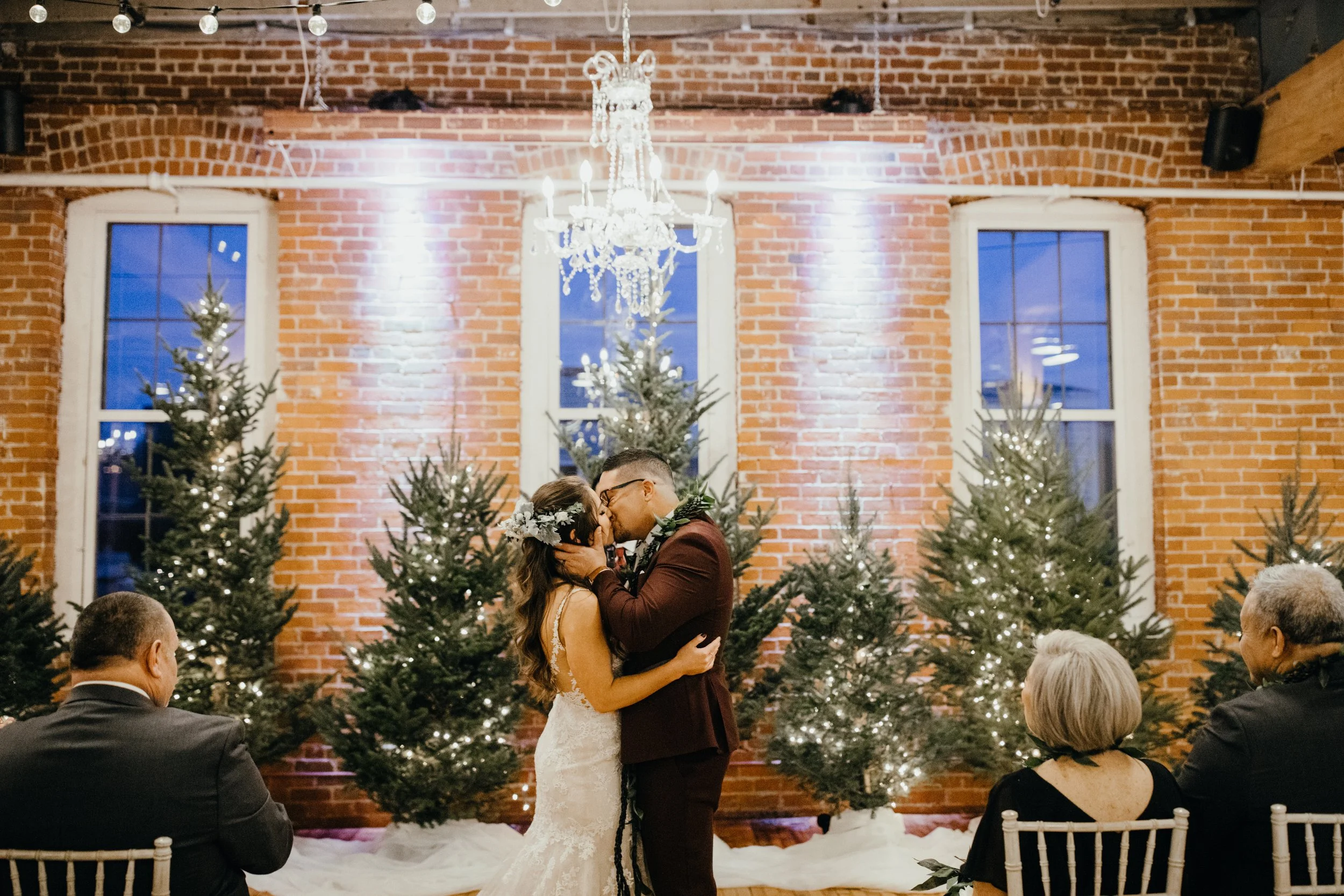 Bride and groom kiss during Stillwater, Minnesota wedding ceremony at JX venue