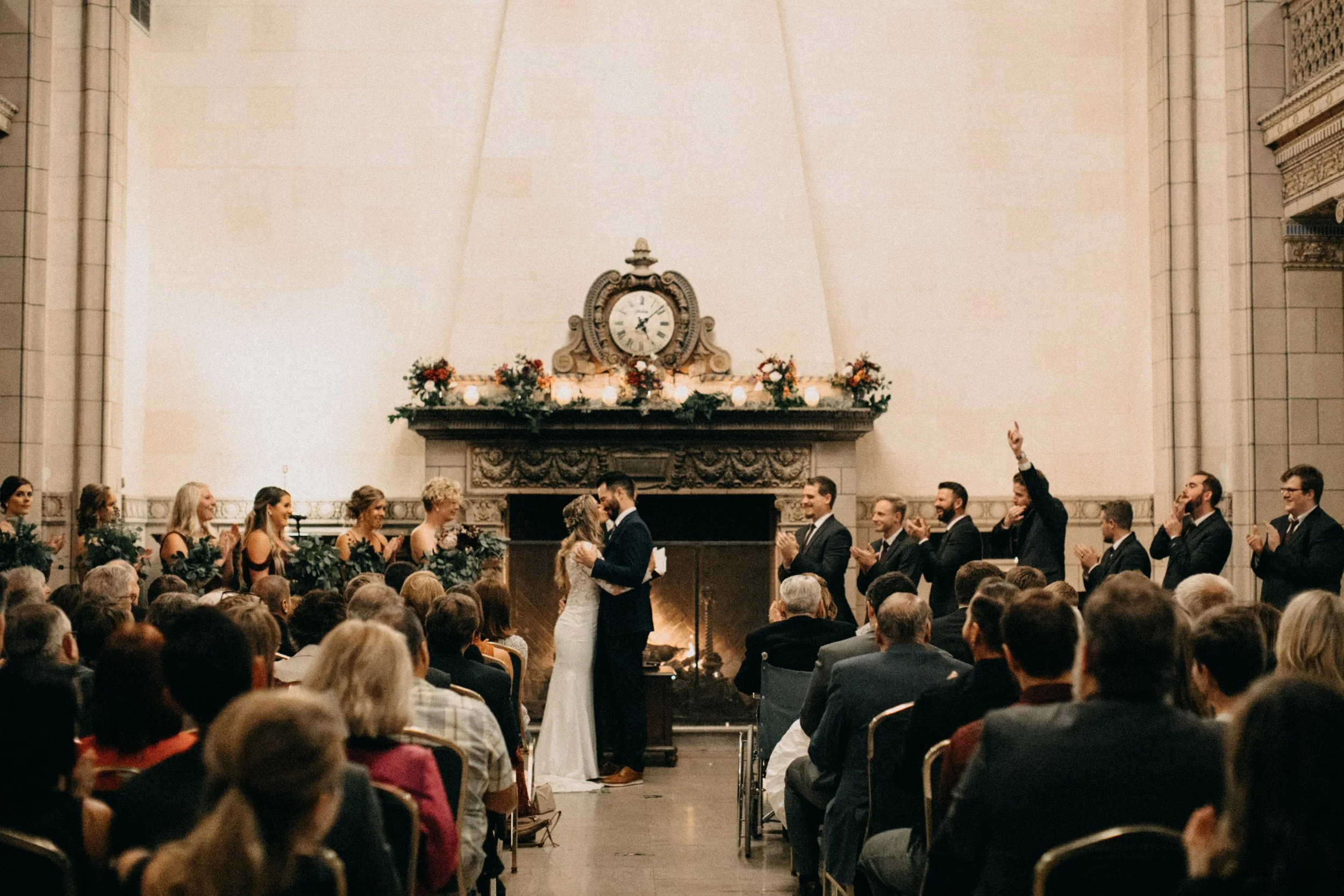 Bride and groom wedding ceremony kiss at academia themed wedding in Minnesota
