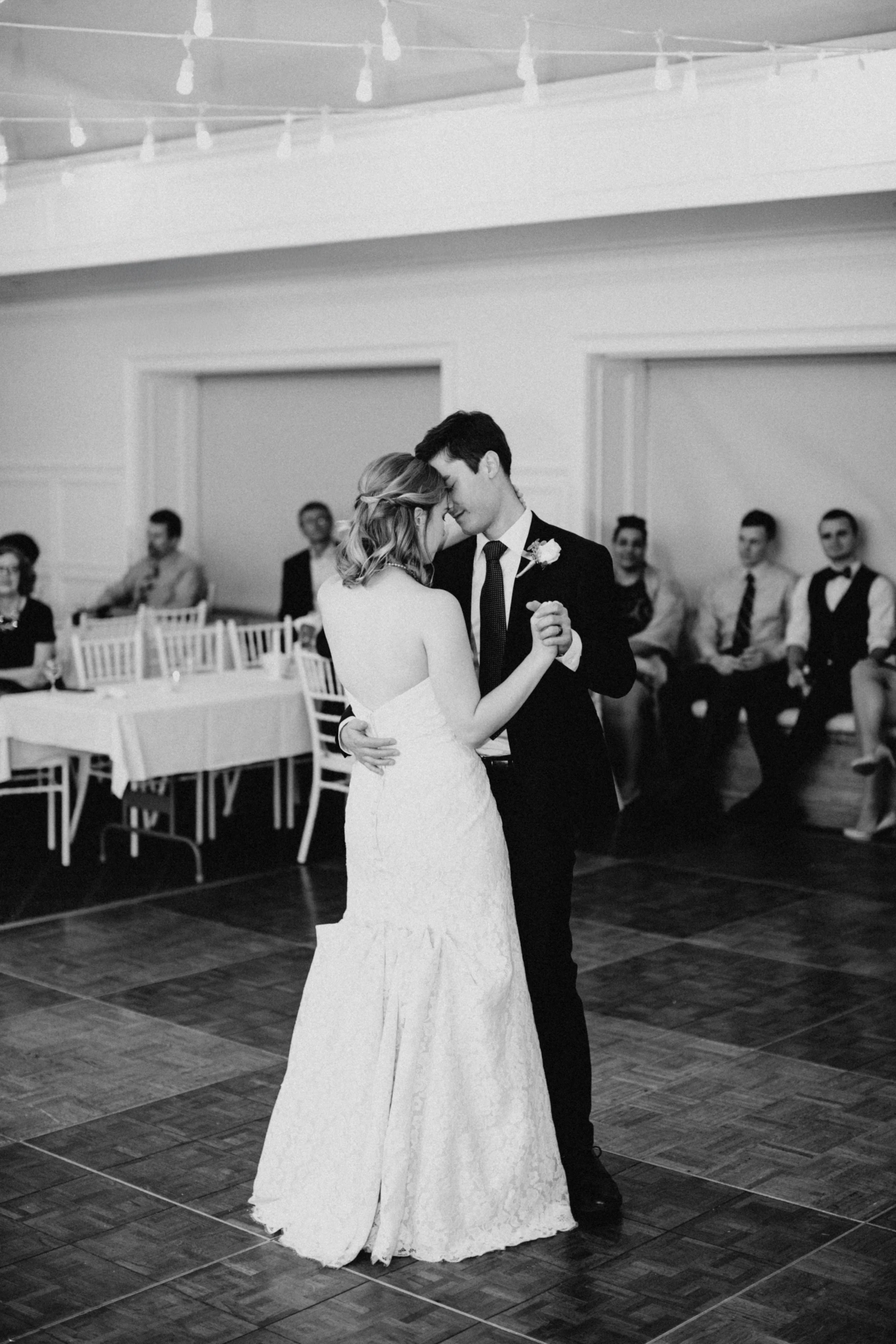 Bride and groom dancing during their St Paul College Club wedding reception