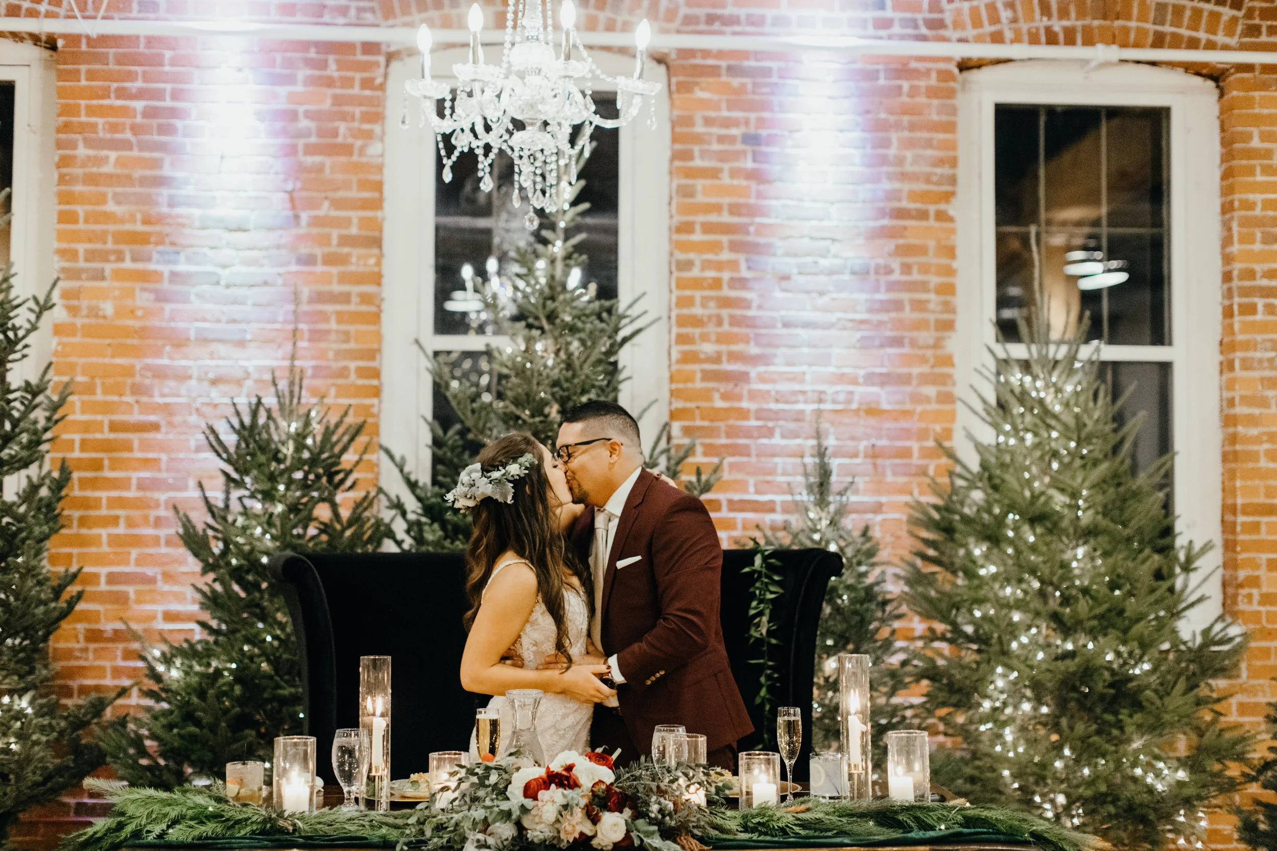 Bride and groom kissing during wedding reception at JX venue in Stillwater, Minnesota