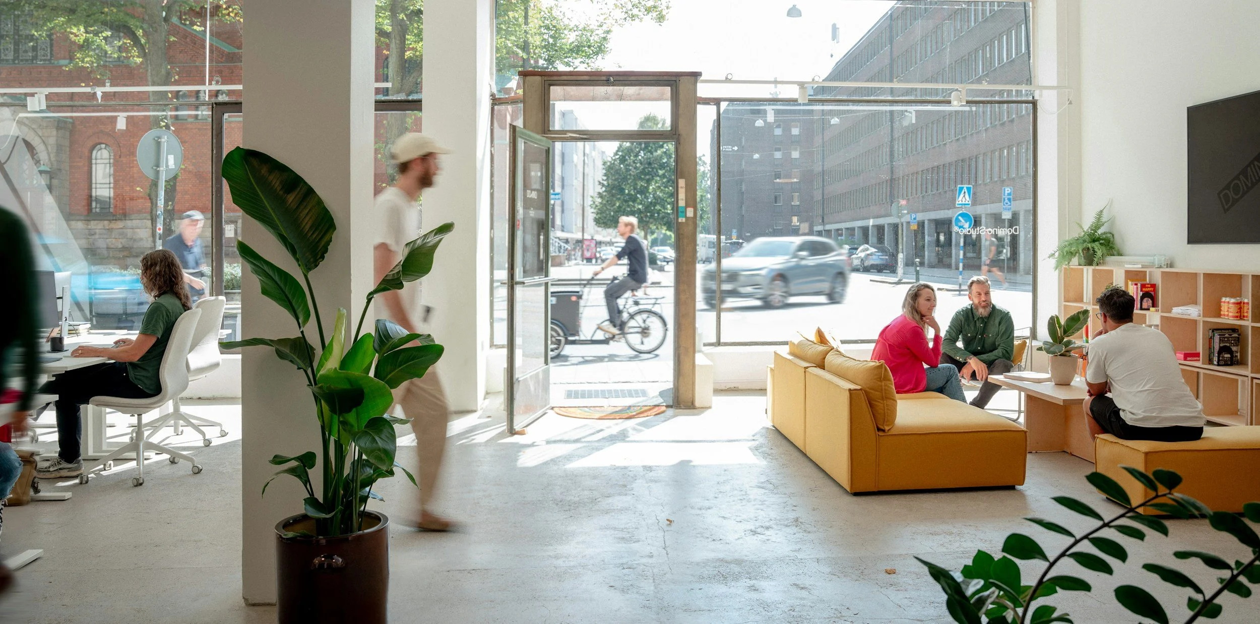 Young professional people in a modern, stylish office in an urban area.