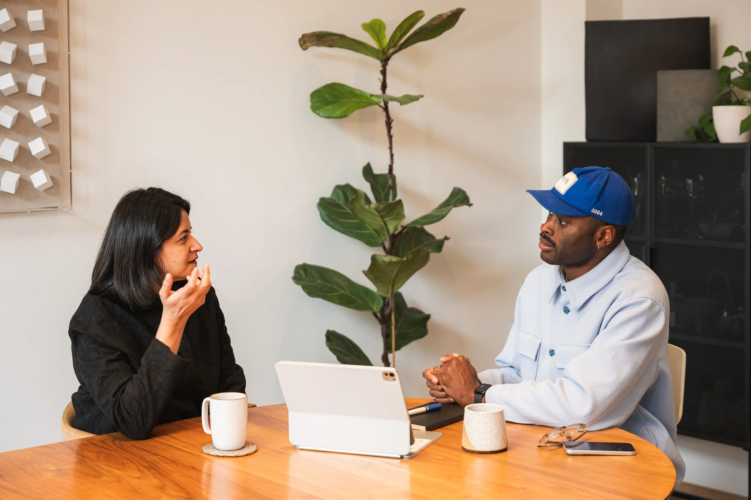 A man provides coaching to a woman.