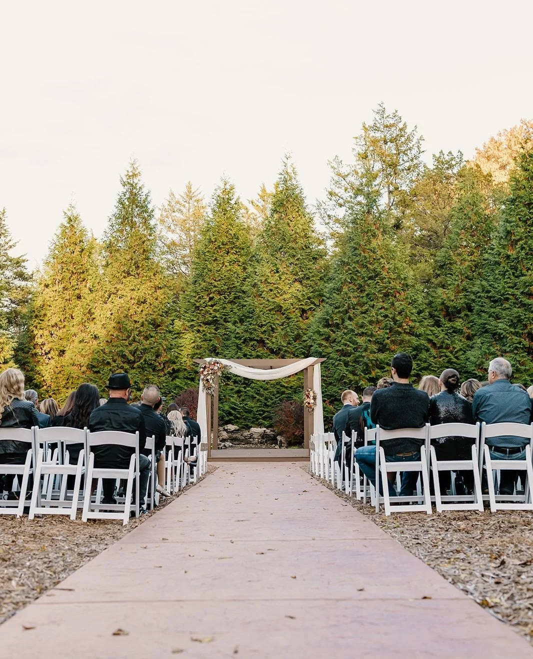 There&rsquo;s something really special about a ceremony surrounded by nature 🌲⁠
⁠
Our outdoor chapel is tucked among mature cedar trees, creating a peaceful, intentional space that feels timeless in every season. It&rsquo;s one of the first things c