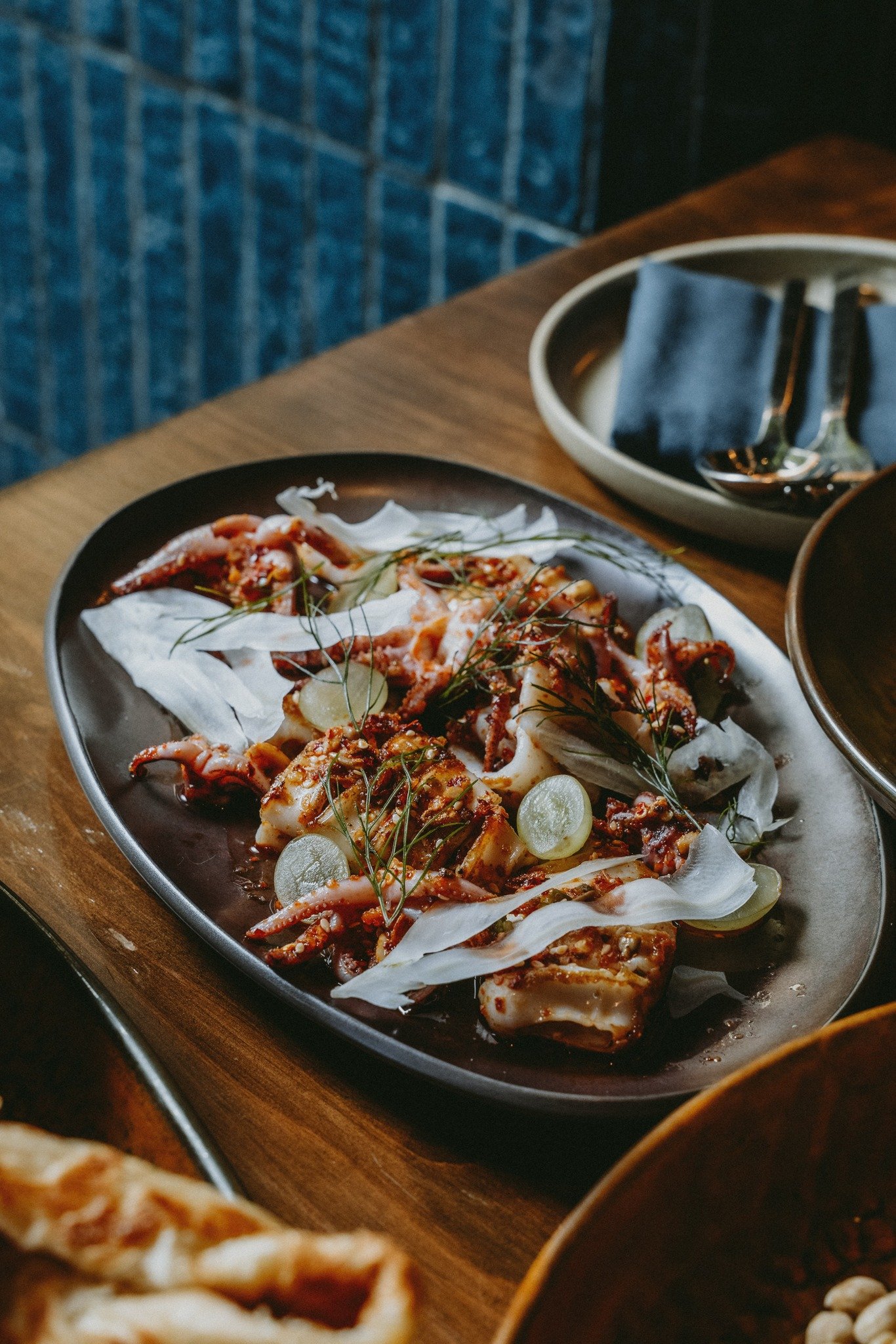 Teakwood's plancha calamari is a showstopper! Seared calamari served with Burmese chili crunch, lime, fennel and grape. Visit us in Hayes Valley for a taste of Burma.

#burmalove #teakwoodbyburmalove #sfrestaurants #sfbars #sfeats #sanfrancisco #baya