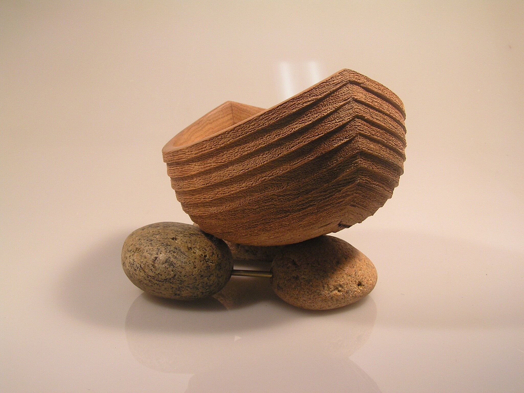 "Waiting for the Tide"
Marri, beach rocks, brass rod.
Boat 250 x 200 x 140 mm
This is the first of many using this title. I love using Marri because it textures so well.
