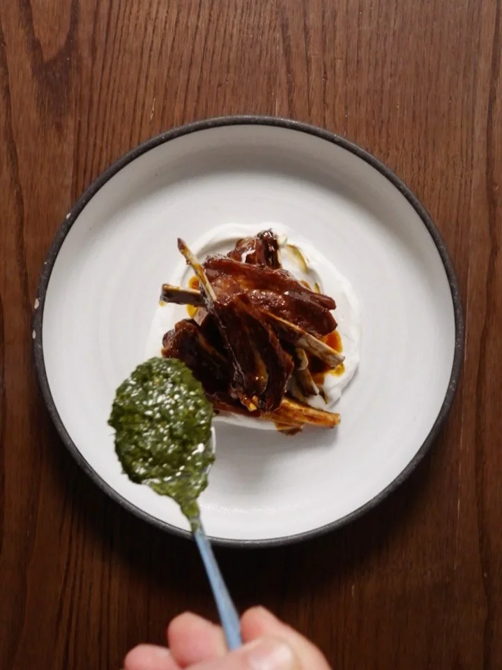This is our lamb ribs. Braised overnight. Orange, yogurt, and coriander to finish.

我哋嘅羊肋排要先醃過夜，再塗上香橙迷迭香醬汁。最後加一匙芫荽莎莎醬，搞掂。

#francis #franciswest #wanchai