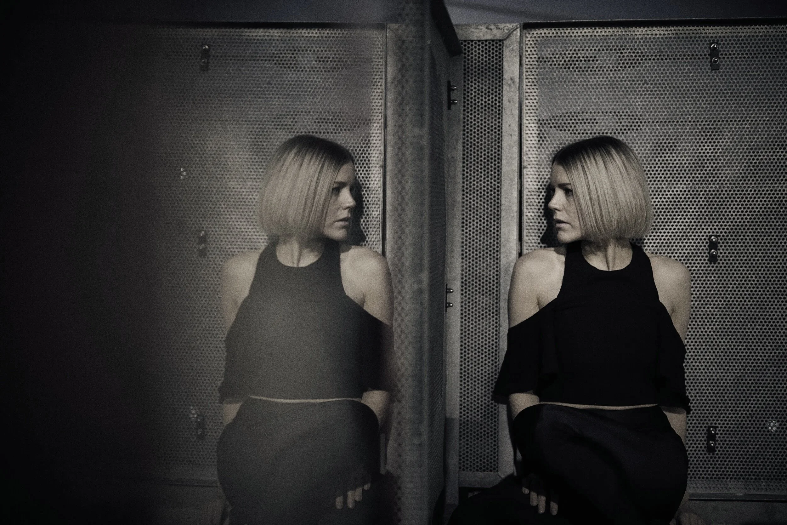 Girl looking at herself in mirror
