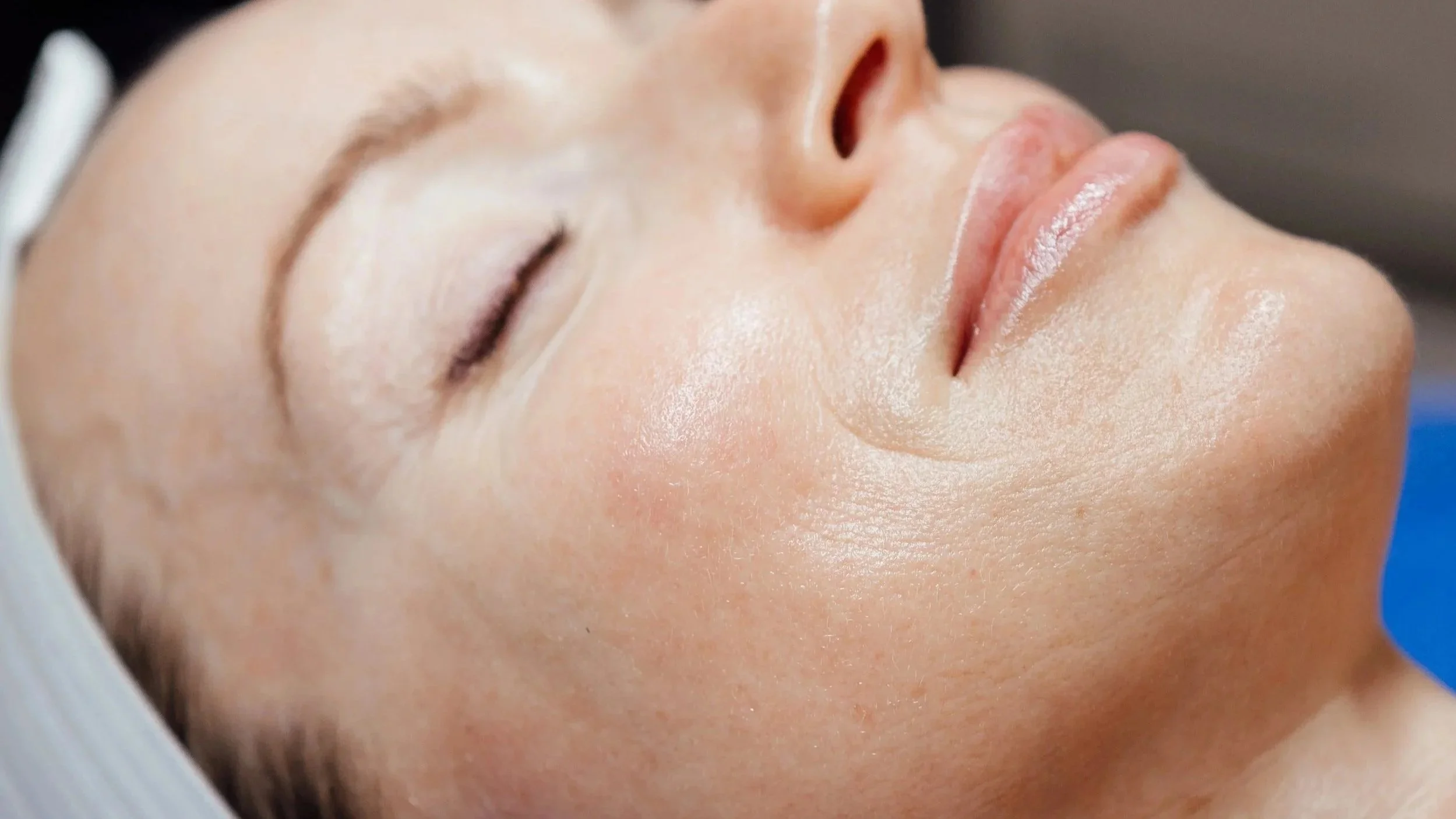 A client relaxing during a facial at The Face Space in Webster, Texas
