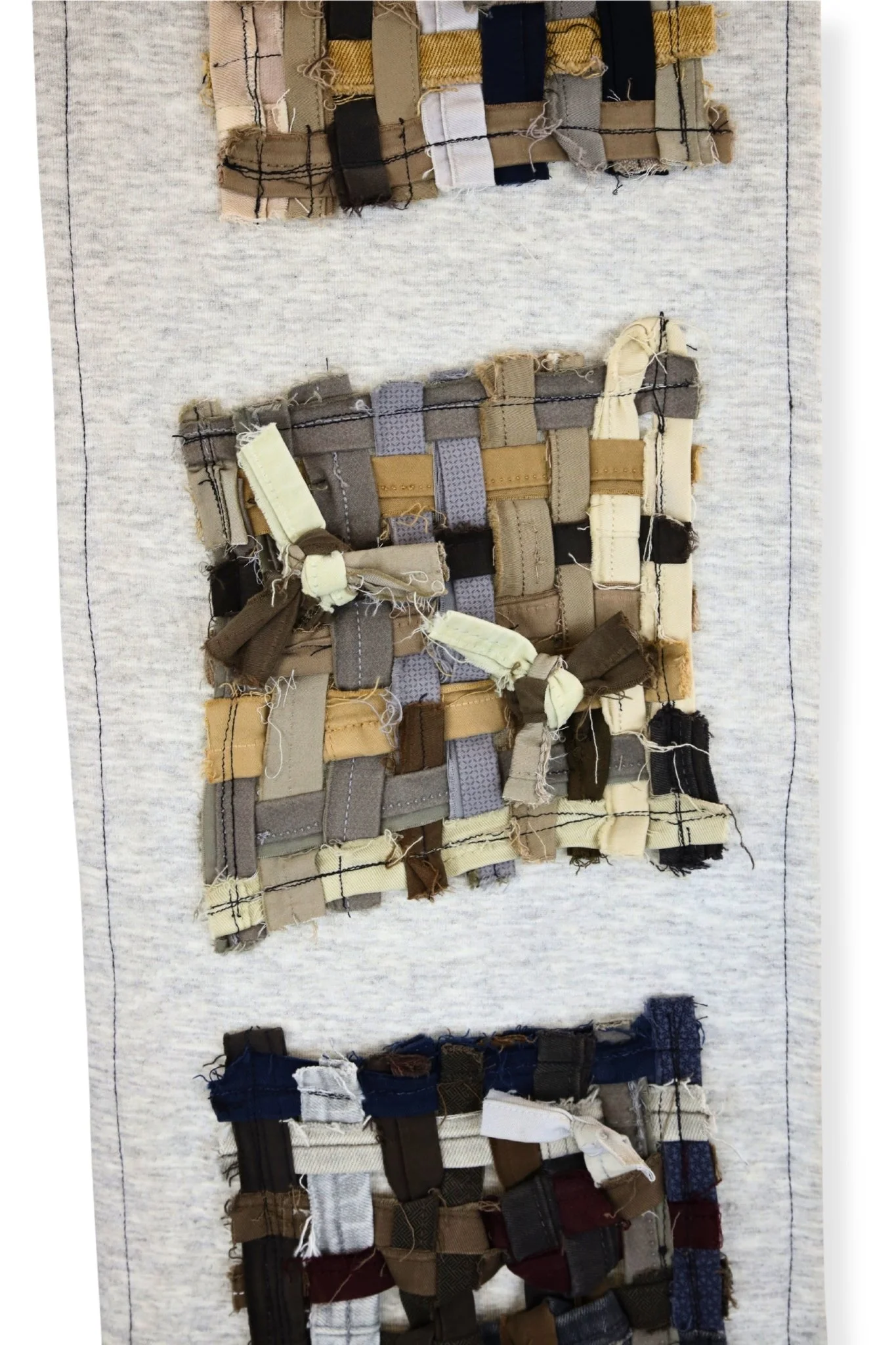 Sewn, woven hem panels sewn on grey back, 48 x 10.5, 2023