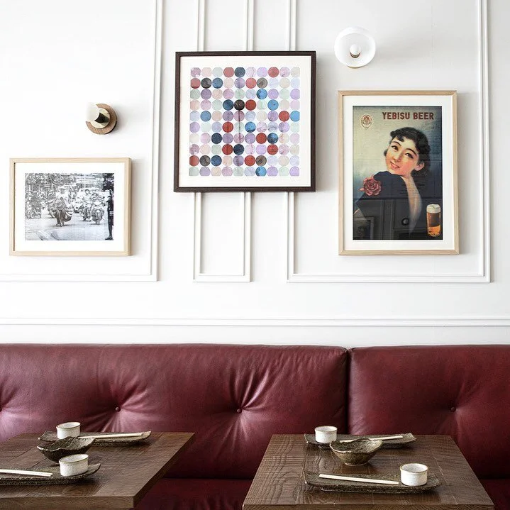 ❤️ Our first restaurant love ❤️ @okarestaurant . We found an aged wine red leather and created a squishy bench for maximum comfort and a laid back feel, we added colourful vintage Japanese posters and porcelain and walnut wall sconces to create an ec