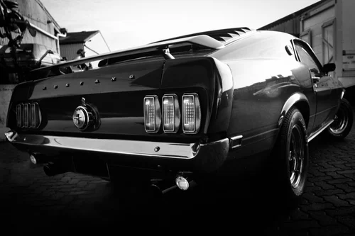 Classic Mustang outside the workshop