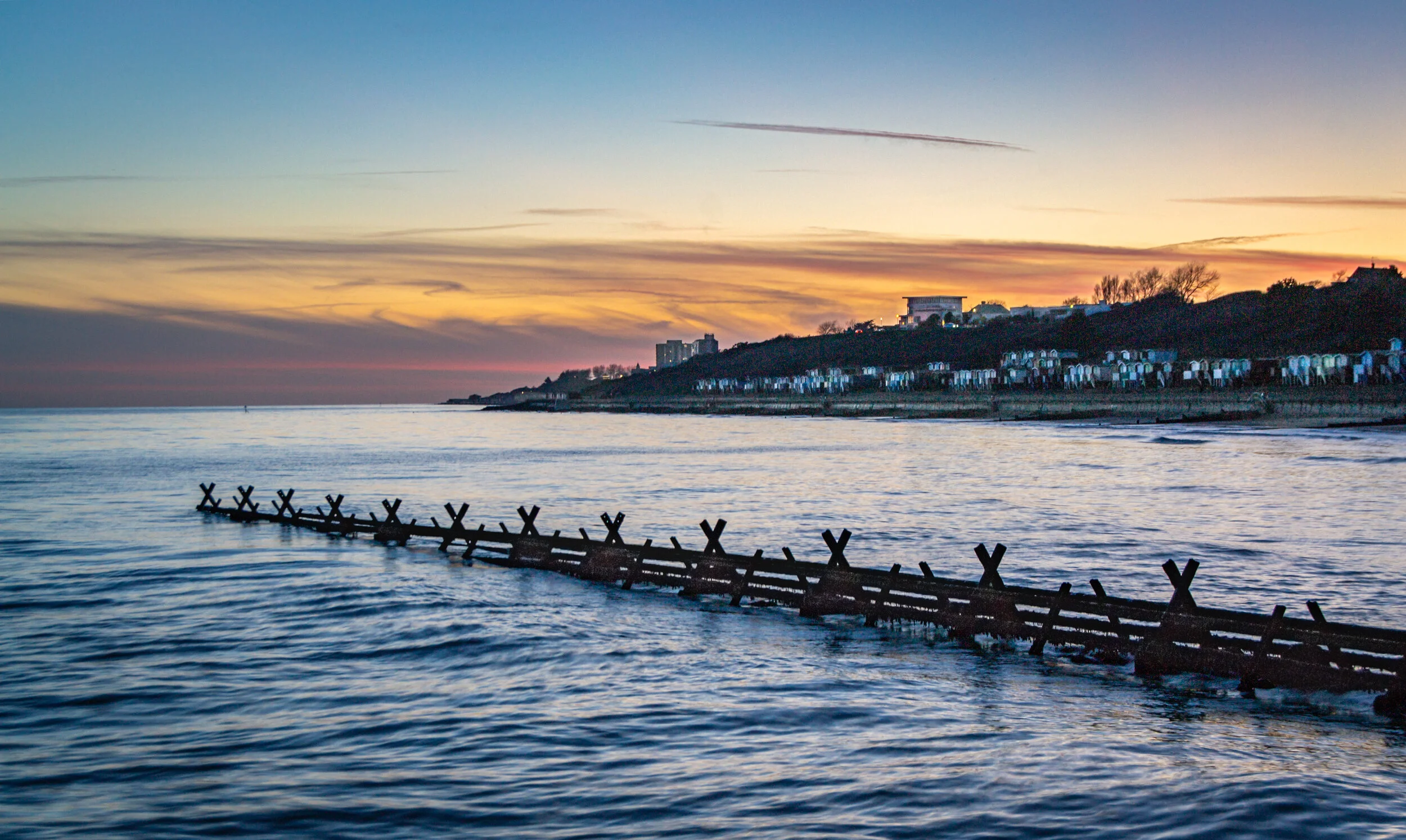 Beachuts and groyne at dusk-1.jpg
