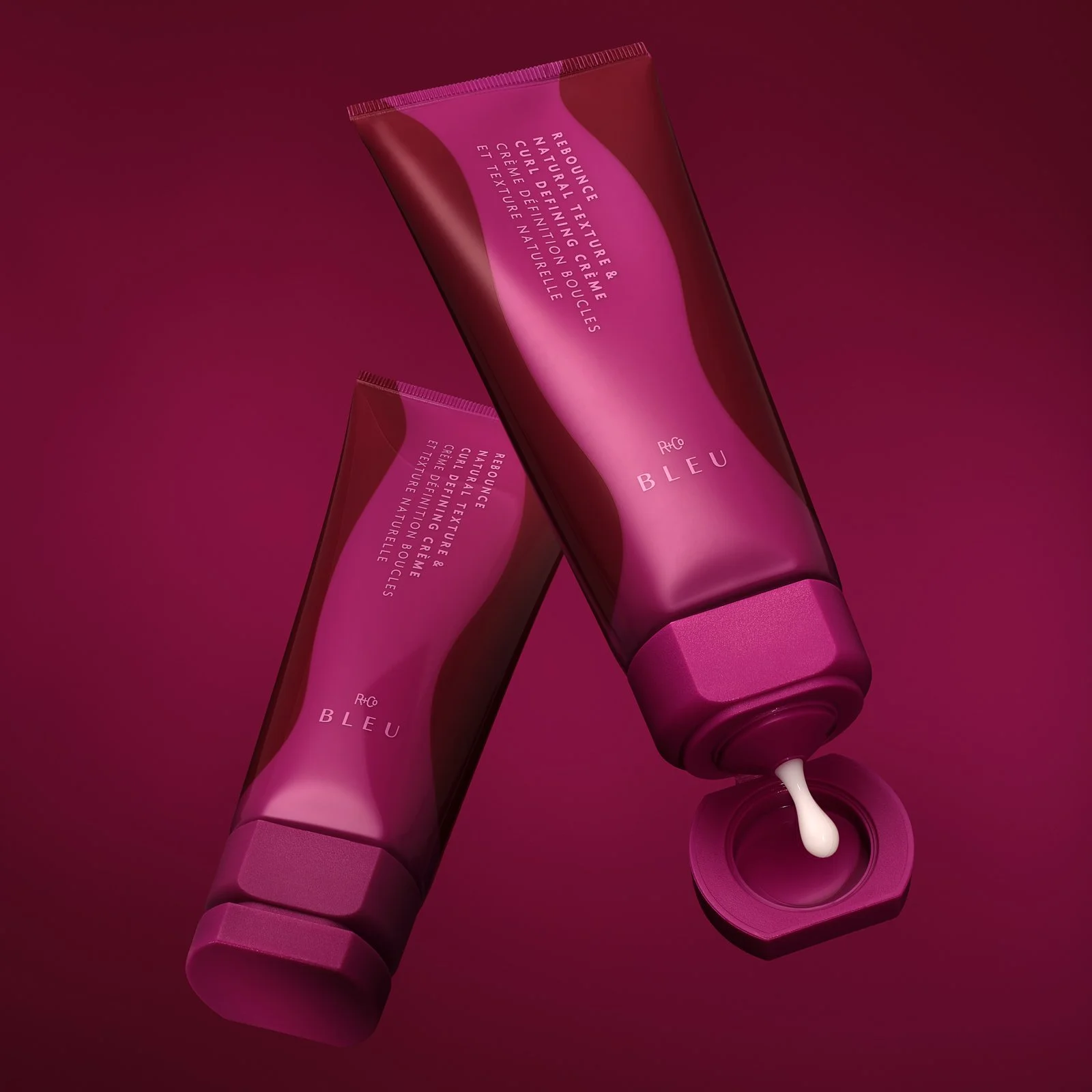 hair-care-bottles-packaging-floating-styling-rig-pink-red-gradient-drip-texture.jpg