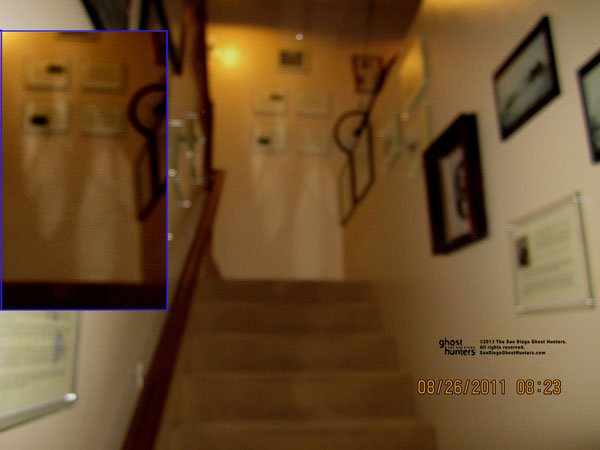 Capture of ghost couple at top of stairs