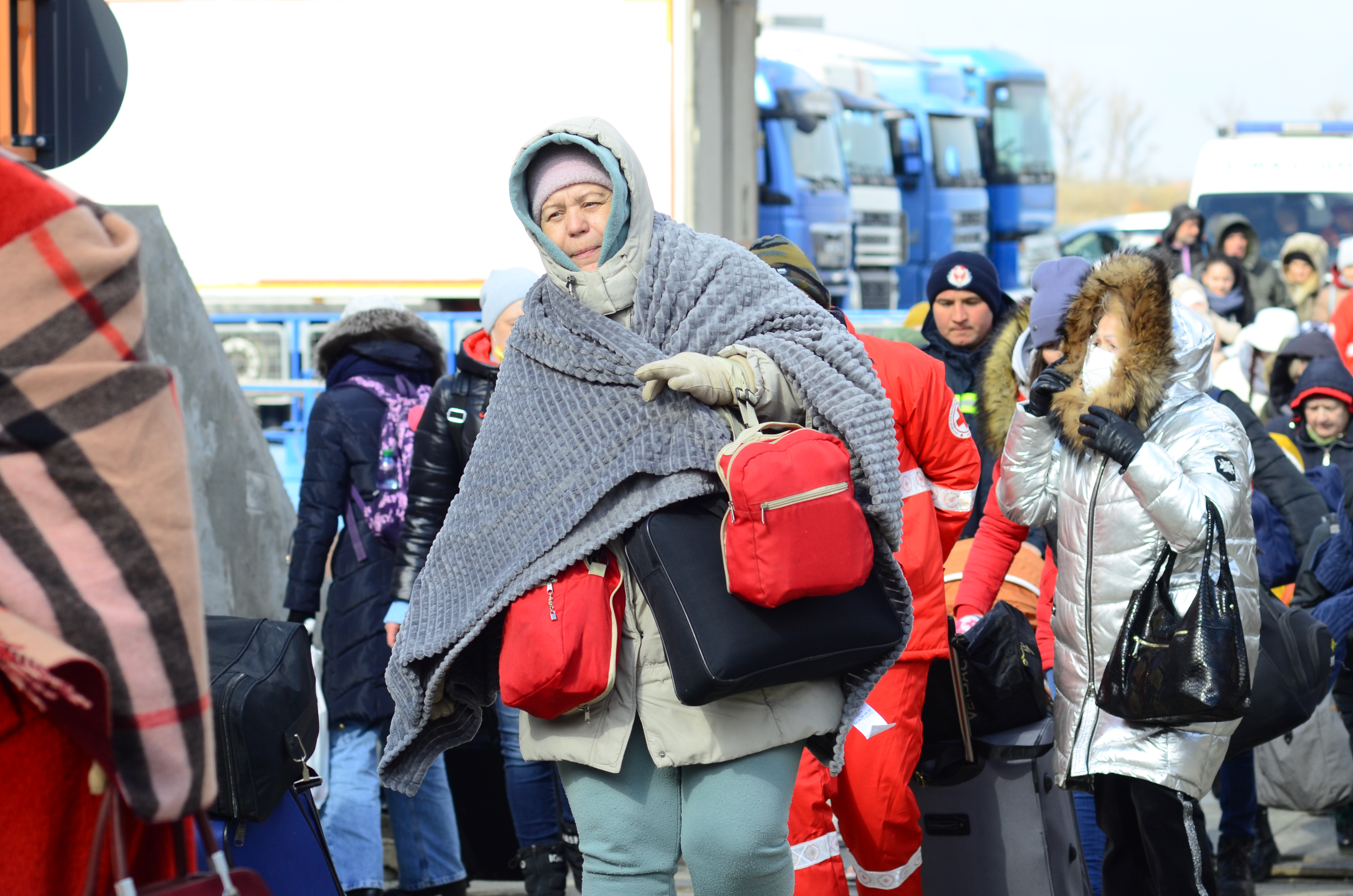 In temperatures of -2, with snow falling and a vicious windchill,, people walk off the Danube ferry wrapped in blankets.