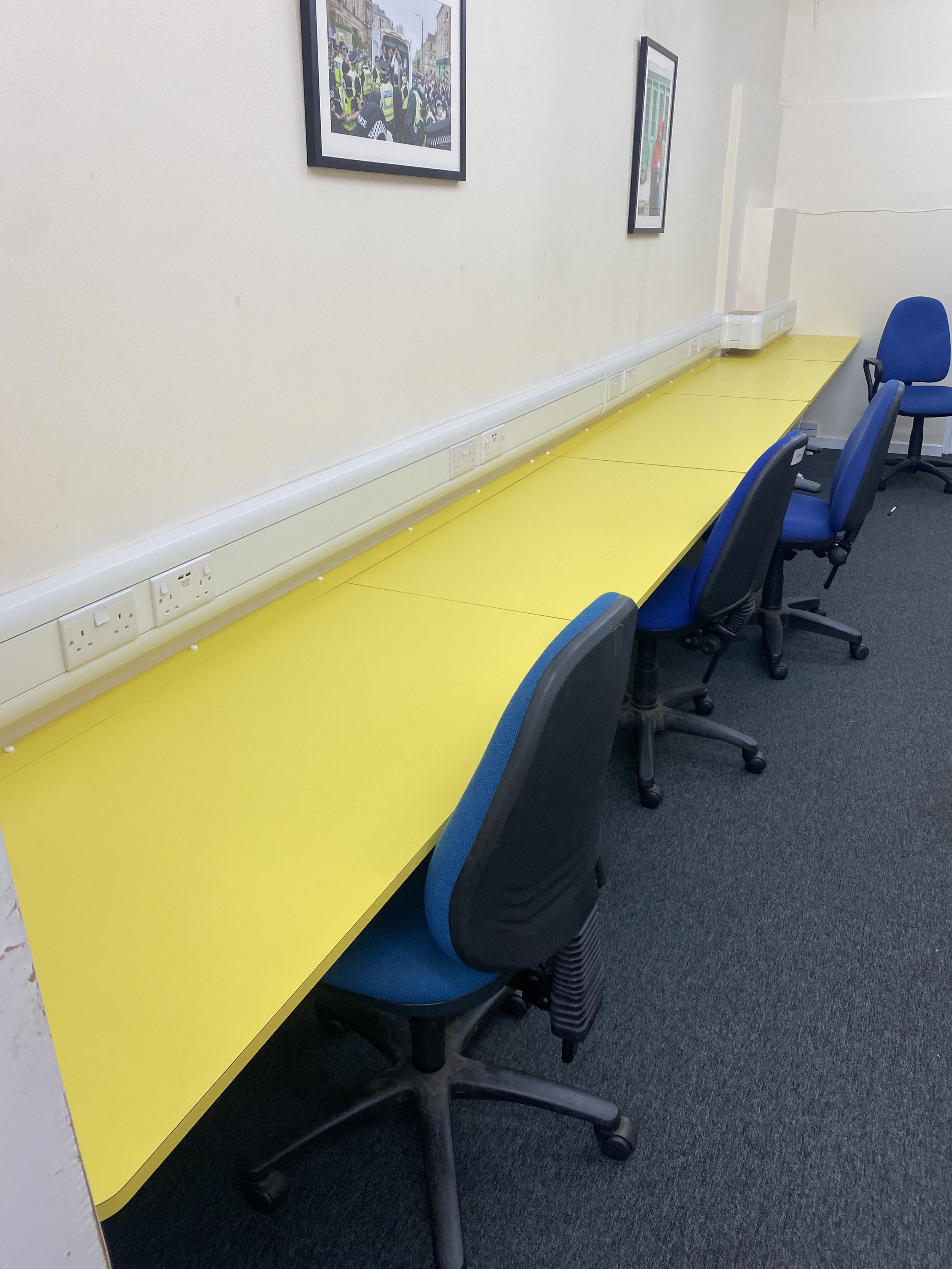 newsroom yellow desks.JPG