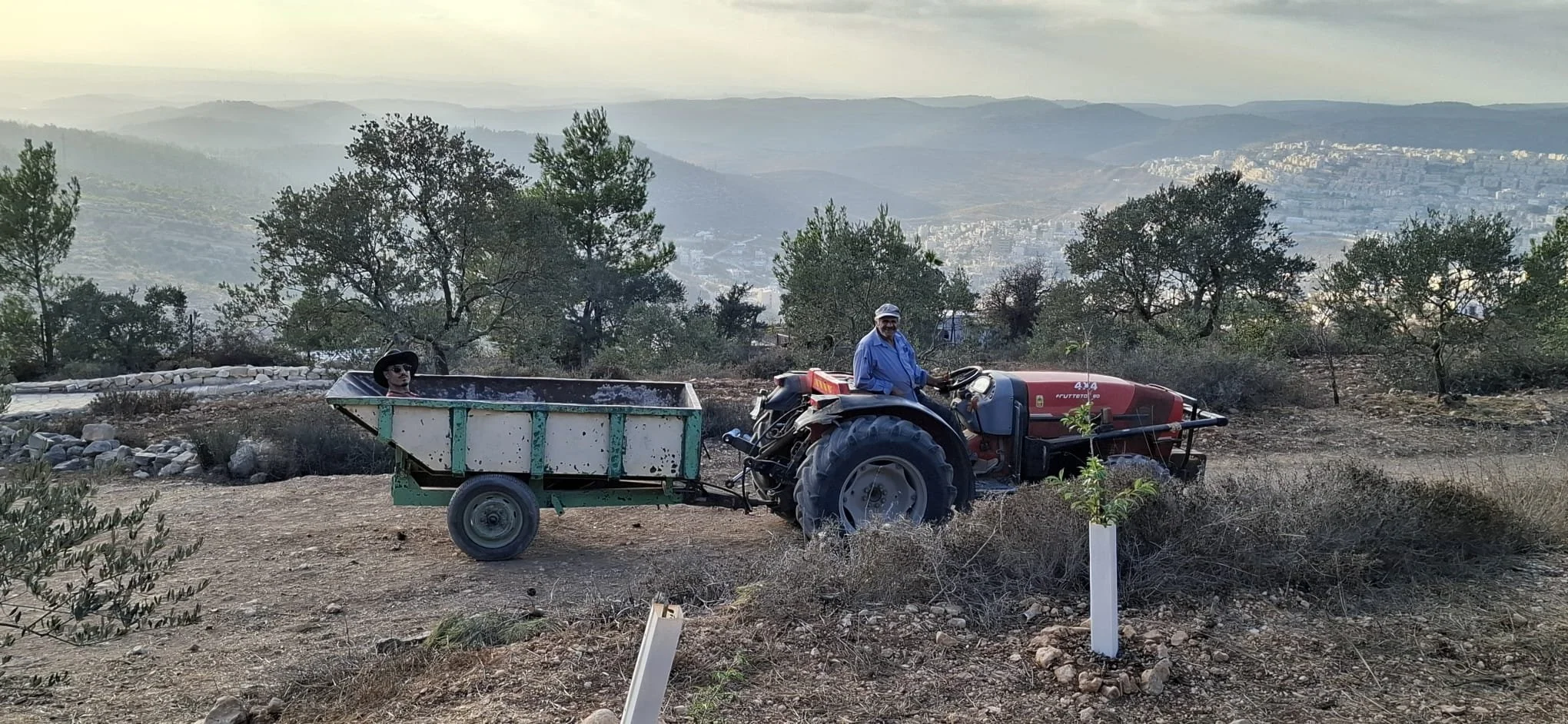 Daher Nassar gives his nephew a tractor ride.jpg