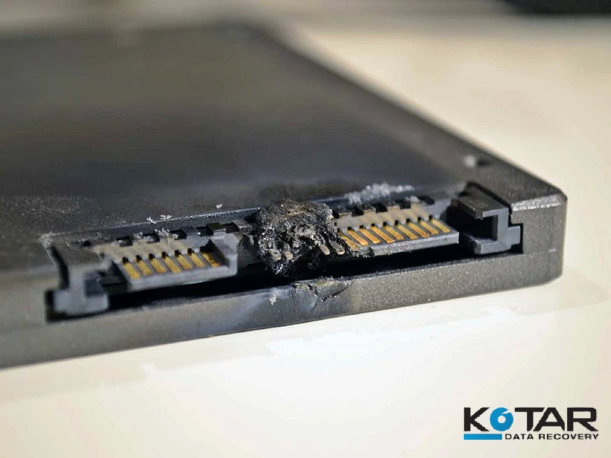 Physically damaged SSD with burnt SATA power and data connector requiring professional data recovery