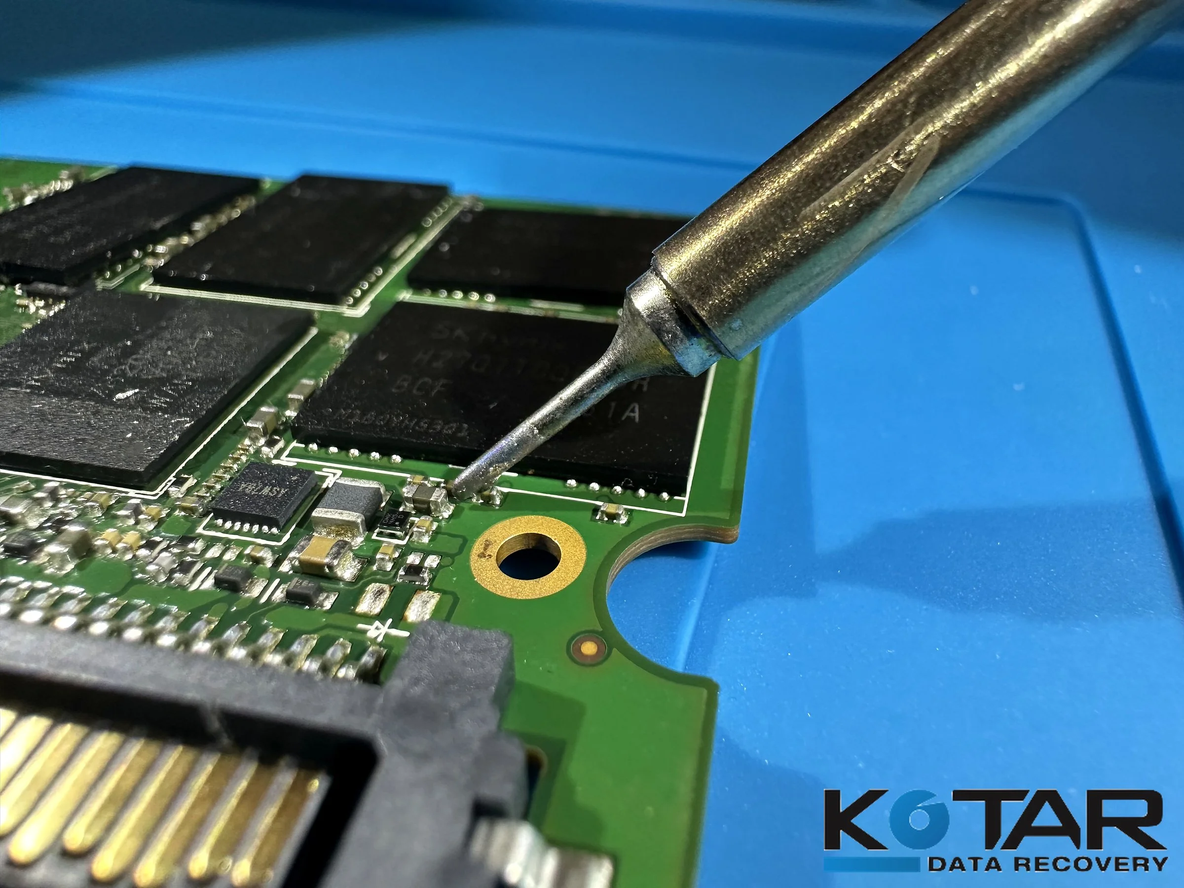 Soldering iron performing precision microsoldering on a circuit board at Kotar Data Recovery’s San Jose data recovery lab.