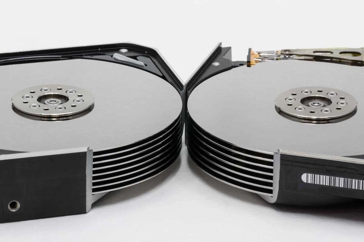 Opened high-capacity multi-platter hard drives representing professional helium HDD data recovery.