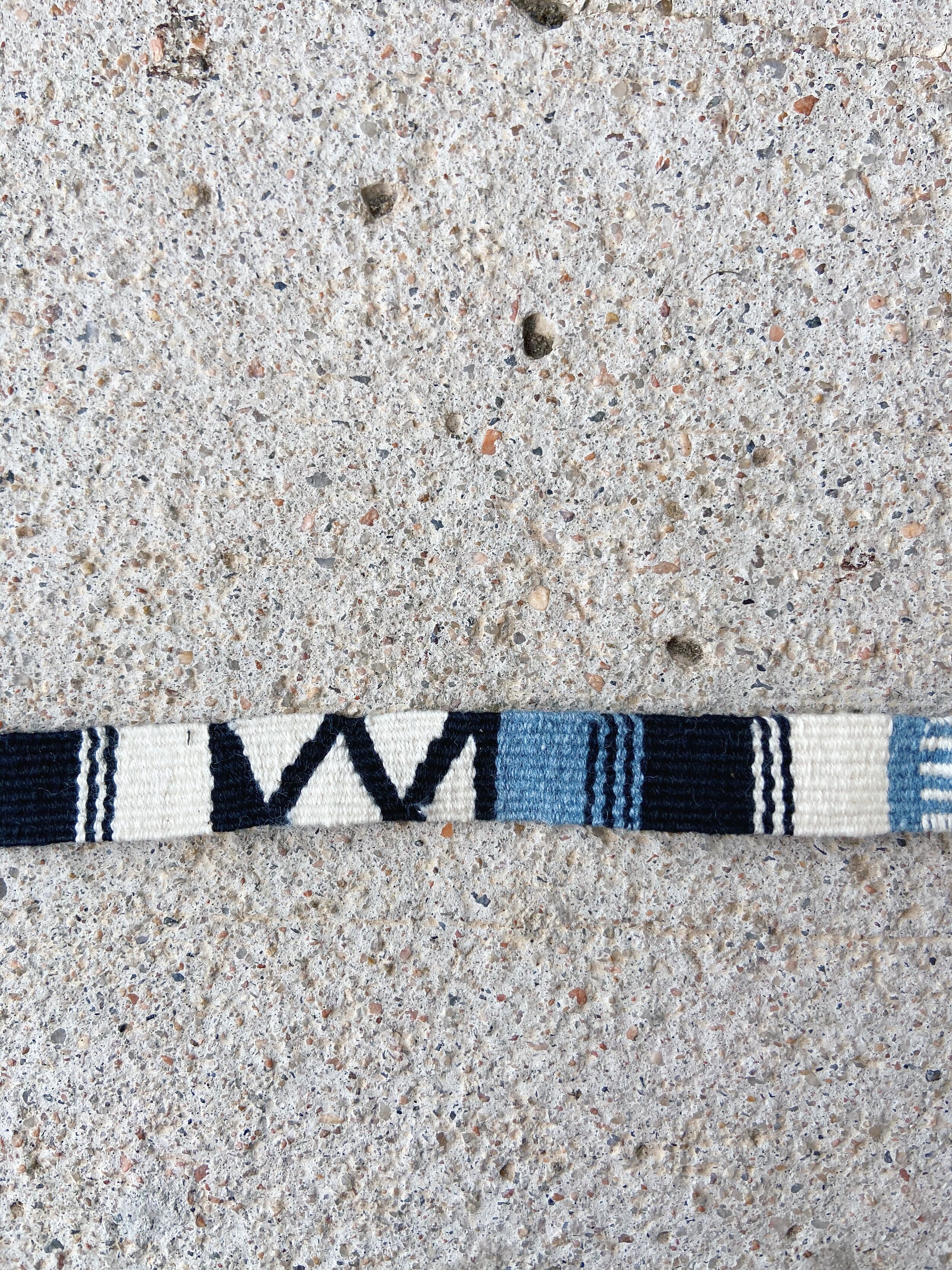 Black and White Cinta Friendship Bracelet, Mayan Hands, close up detail