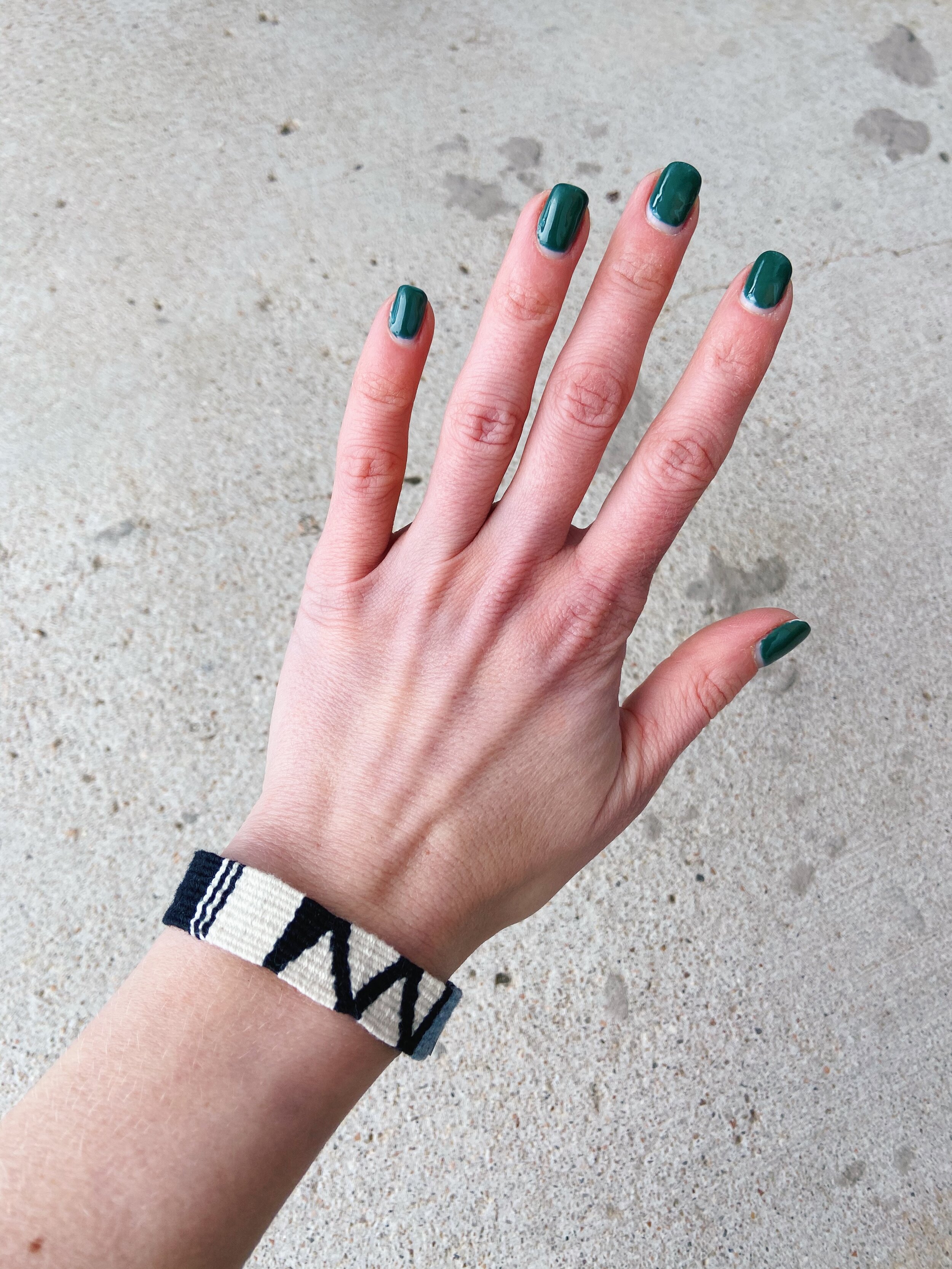 Black and White Cinta Friendship Bracelet, Mayan Hands, worn