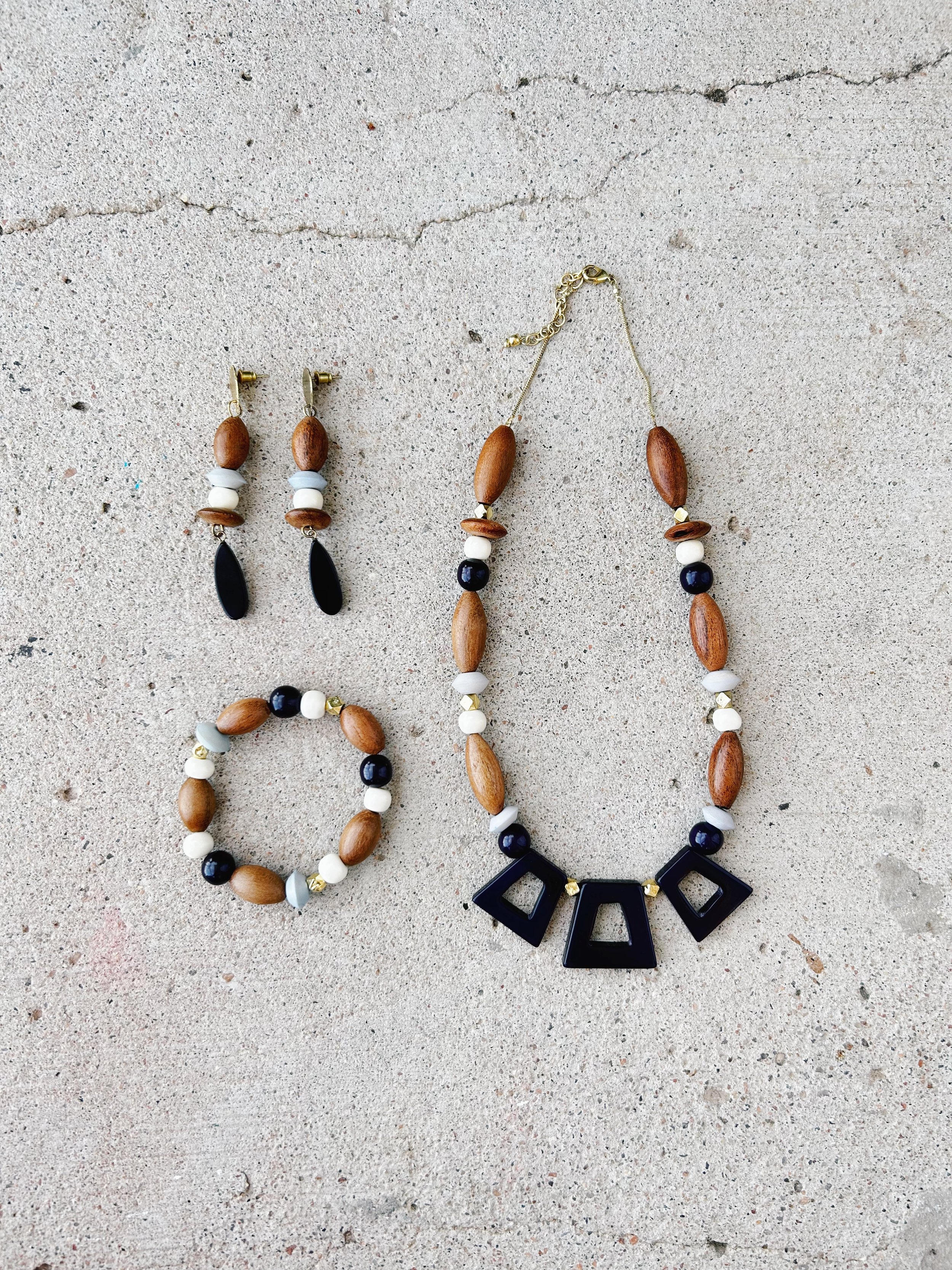 The Kolkata Necklace is featured in a flatlay with the Kolkata Earrings and Kolkata Bracelet.
