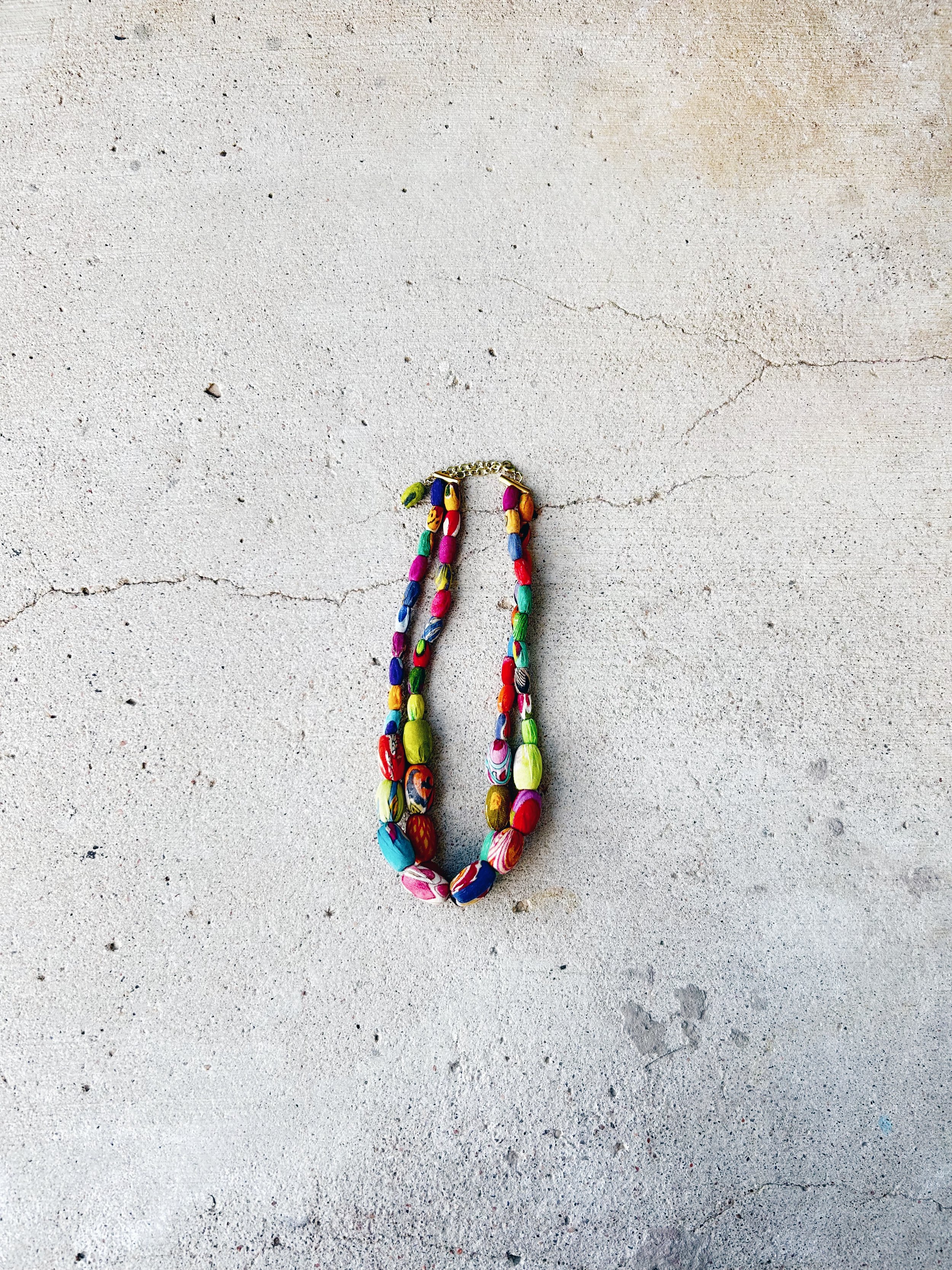 The Elliptical Layers Kantha Necklace is shown from a distance.