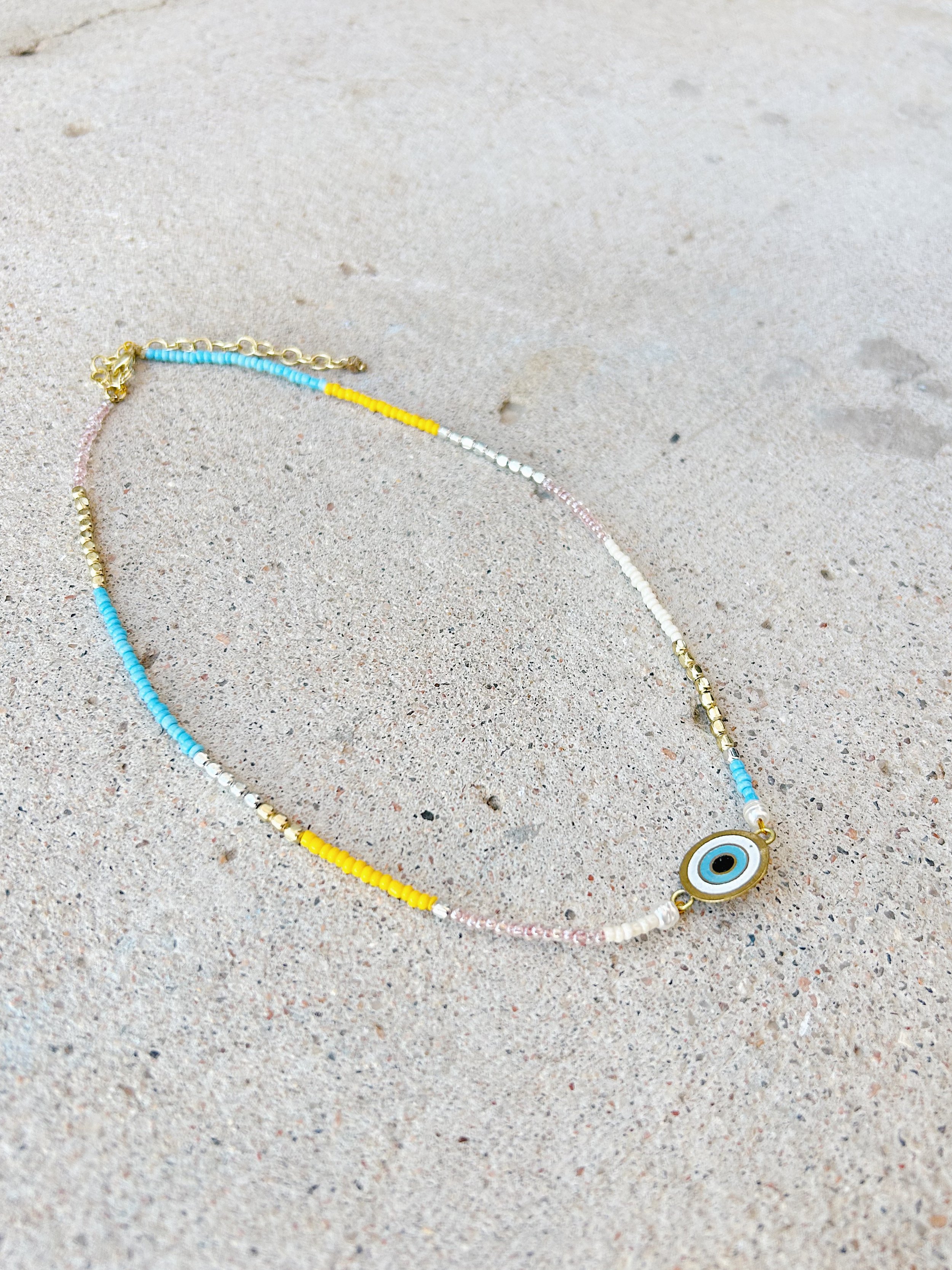 The Double Vision Necklace is shown on an angle so all of the colorful beads can be seen.