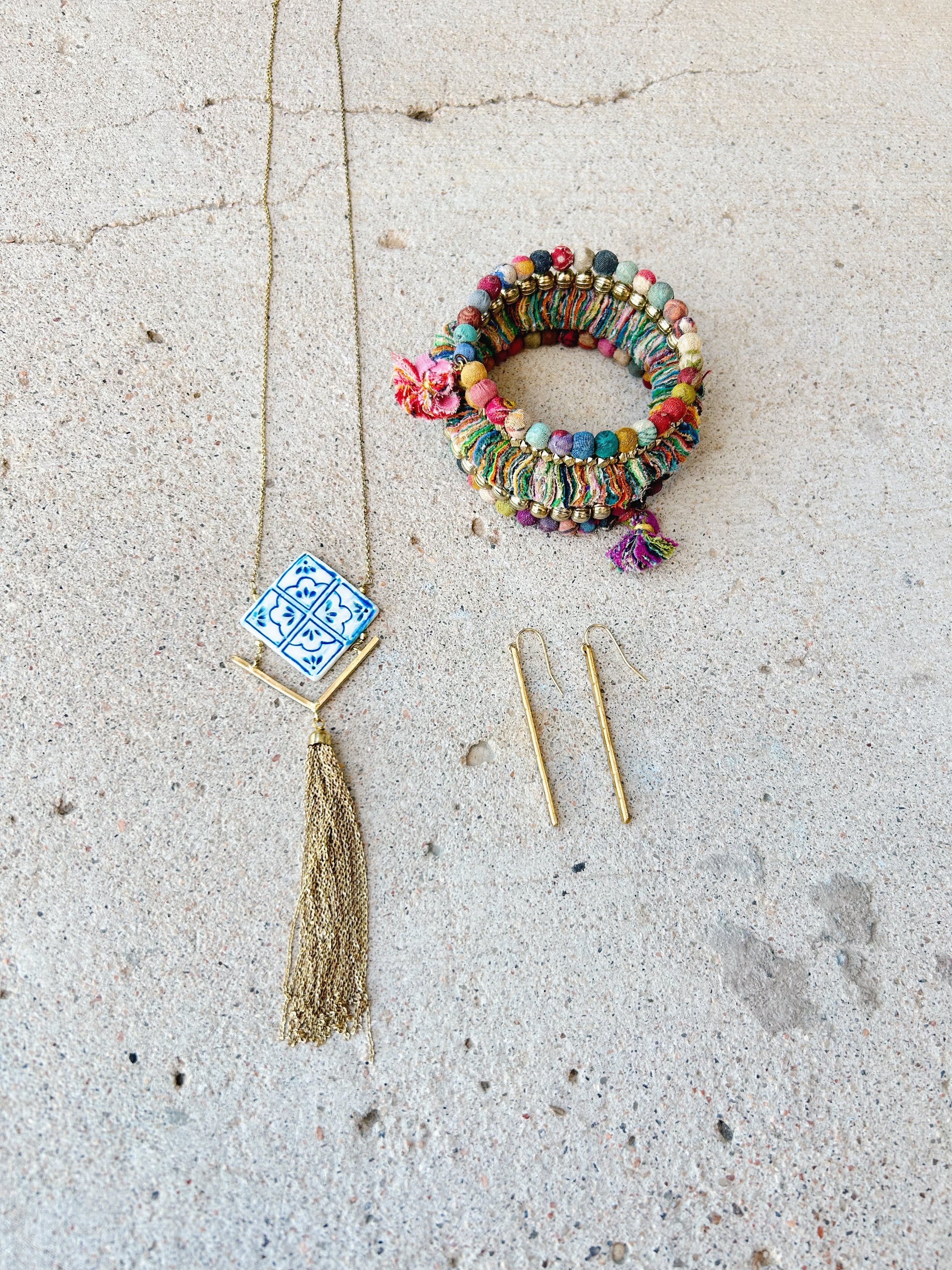 The Mallorca Tile Necklace pairs well with the Fractal Kantha Spiral Bracelet and the Resilience Earrings.