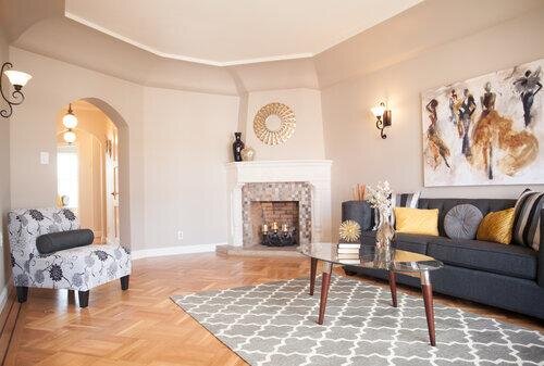 Bright living room with fireplace and contemporary furniture in a staged home