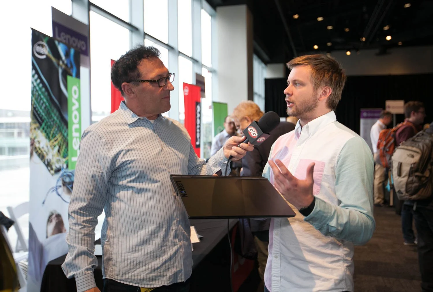 Man being interviewed at a corporate event