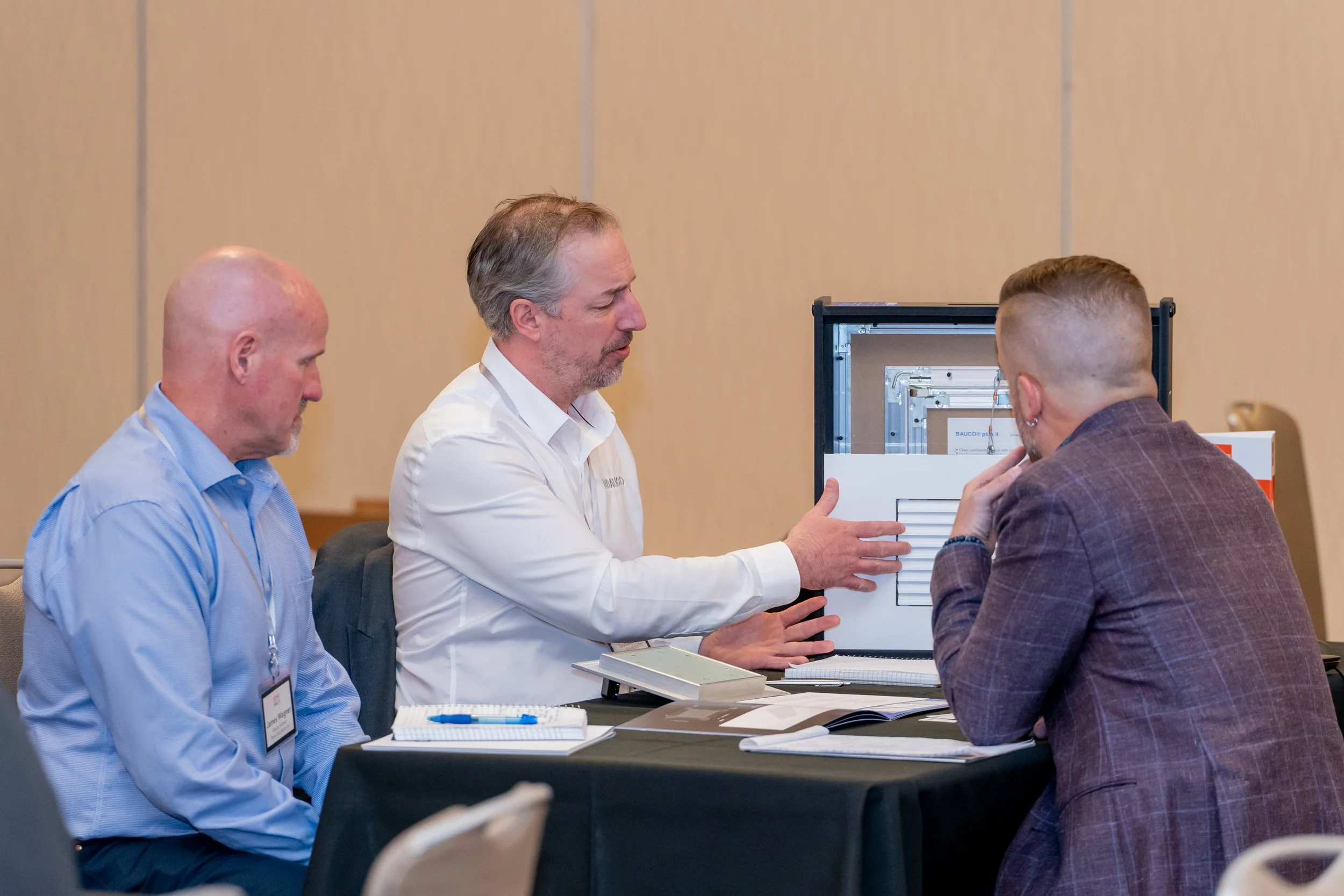 Corporate event participants discussing business solutions