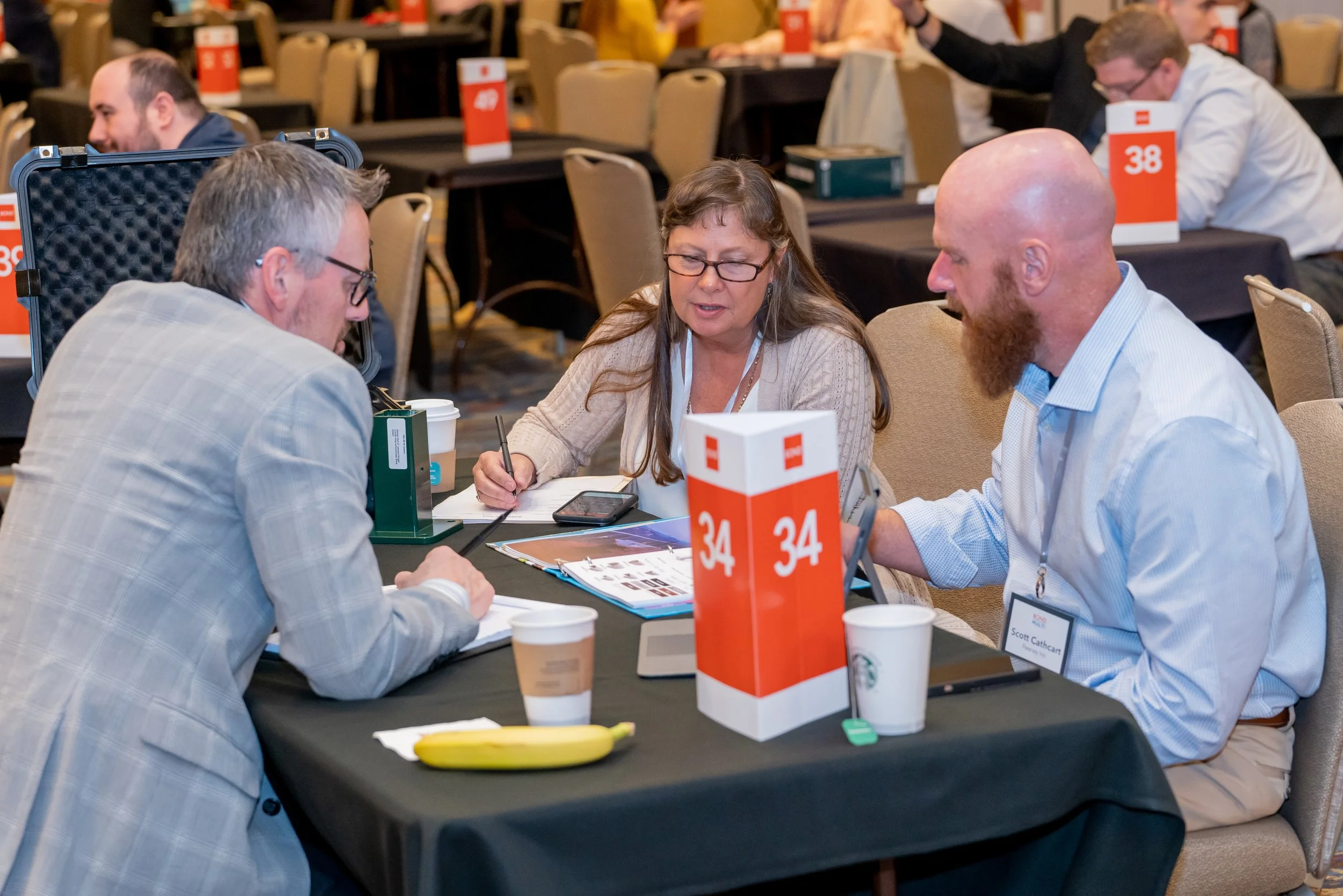 Corporate event photography capturing business professionals in conversation