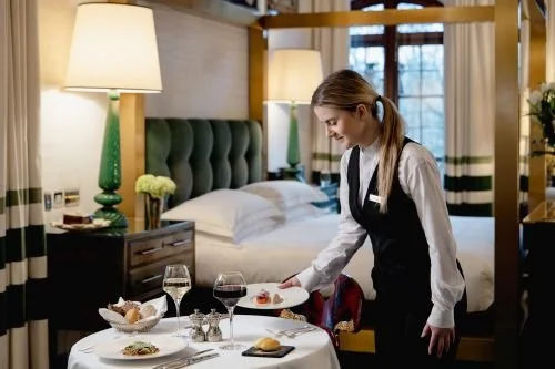 In-room food service with uniform supplied by Joseph Alan, part of Dennys Brands