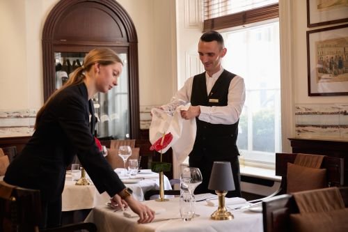 Food and beverage service with uniforms supplied by Joseph Alan, part of Dennys Brands