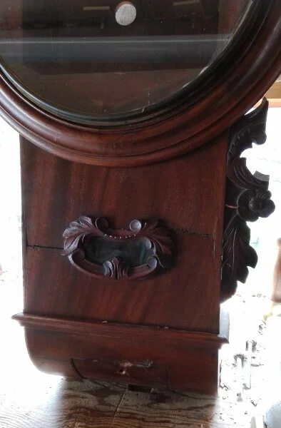 Drop dial clock in need of repair to decorative side drops
